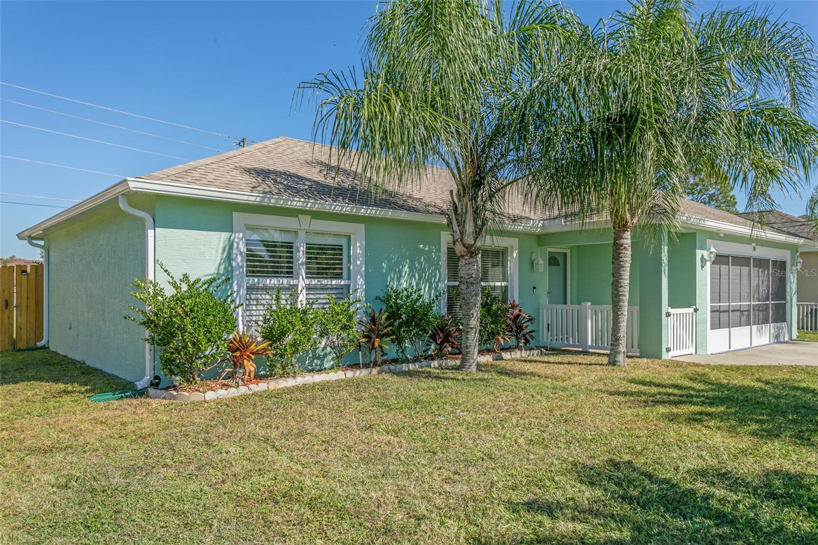 Better Than New... This concrete block home has steal studs not frame. New Roof, New A/C Updated Baths and Kitchen. Beautiful Granite Counter Tops, Back Splash, Large Island with Extra Drawers, New Appliances including double oven, New Interior and Exterior paint.
Plantation Shutters, New Front Door and Garage Screen. Split Floor Plan, A Family Room and Separate Living Room. Fenced back yard with plenty of room for a pool. A Charming gated entry with storm door welcomes you home. Laundry is inside the home. This is a Must See to Appreciate. Seller will consider selling furnished with the right offer.