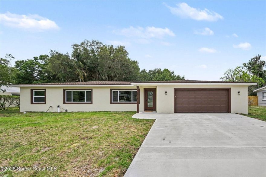 Welcome to 2678 Pine Ave, a beautifully refreshed home set on a spacious .46-acre lot, perfect for anyone who wants room to spread out and enjoy Florida living. Inside, you'll find a bright, inviting layout with tasteful updates throughout, including all-new windows that bring in tons of natural light. The expanded primary suite offers the extra space everyone wants, creating a true retreat at the end of the day. The kitchen is designed for everyday living and easy entertaining, featuring a large island with pop-up outlets, a microwave drawer, and plenty of workspace. A new roof and a brand-new septic system add peace of mind, while the oversized 2-car garage gives you all the storage you need for tools, toys, and hobbies. Laundry is conveniently located inside the home, making daily routines a breeze. With modern upgrades, thoughtful improvements, and a generous lot, this home blends comfort, style, and practicality in all the right ways.