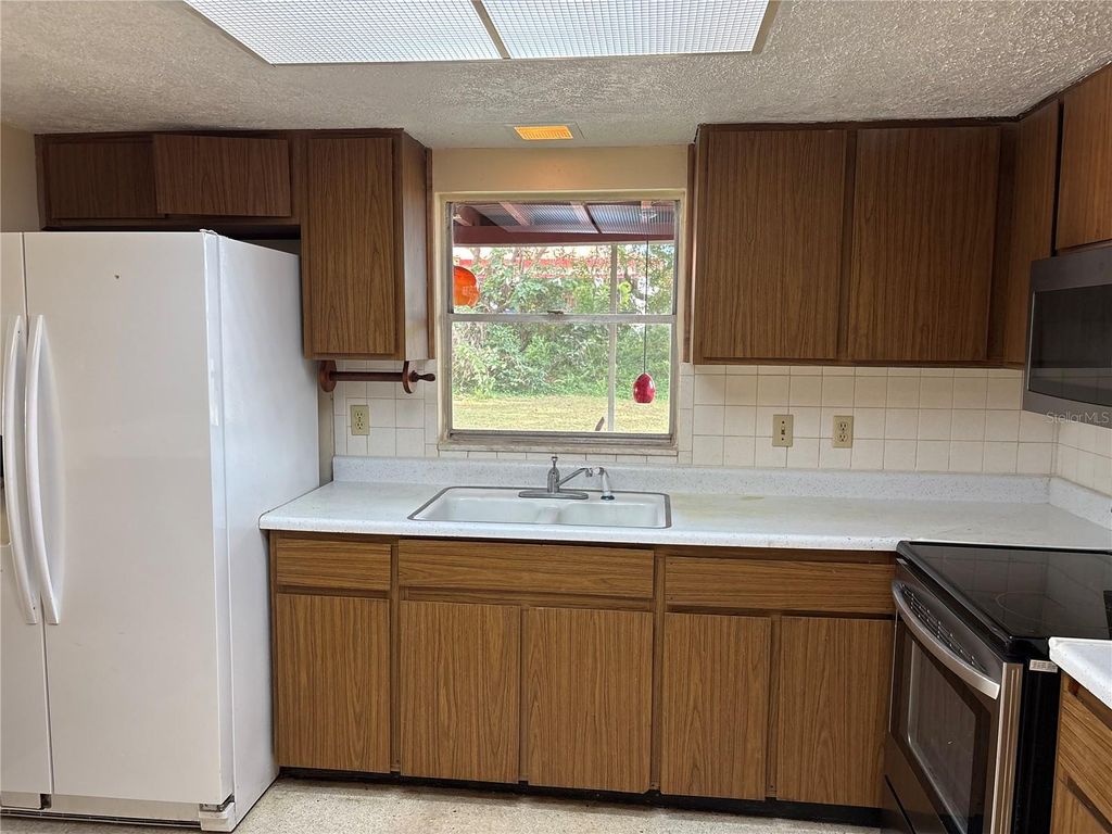 Photo of 5107 E 120th Avenue, Temple Terrace, FL 33617 (MLS # TB8500394)