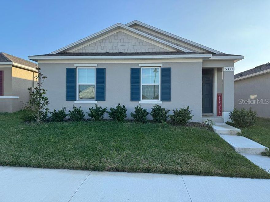 This stunning four bedroom two bathrooms home awaits you in the heart of Apopka. Enjoy living at Windrose community offering community pool and walking trail. As you enter this new home, you'll notice the expansive vinyl floors thruout except in bedrooms. Fully open concept make the home bright and airy. Gorgeous kitchen with vent out, stone counter top, breakfast bar and island. All stainless steel appliances. Come and see the spacious and functional layout with modern finishes and smart home technology. Two car attached garage at back of home with a laneway. Covered lanai for your BBQ. This home is just a few minutes to the pool, five minutes to Publix and Hwy 429 with quick access to Sandford/ Heathrow. One small pet is allowed.