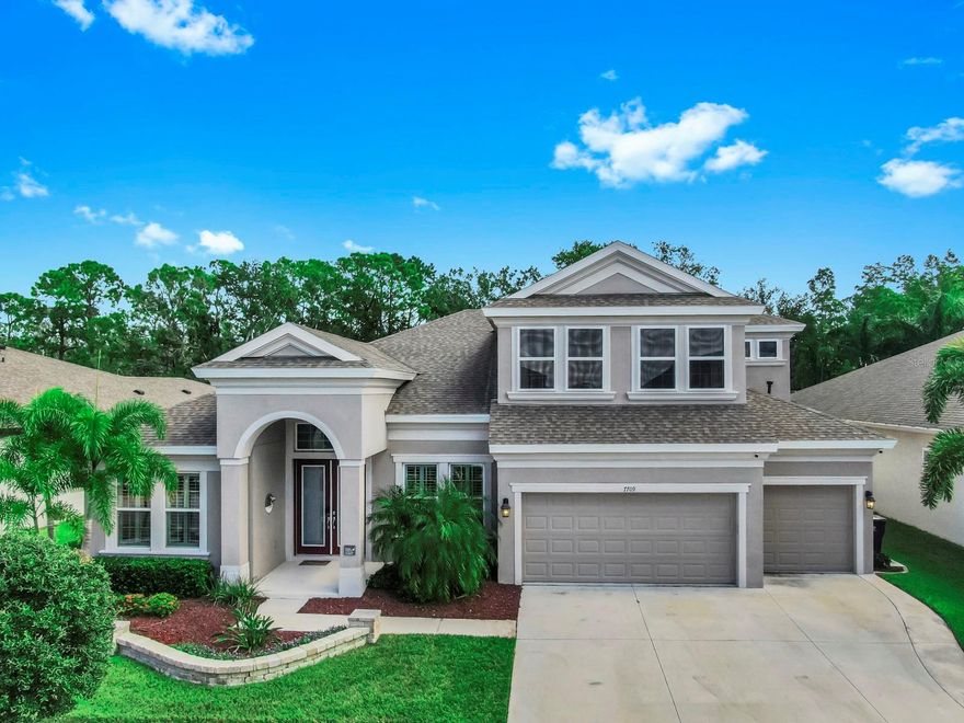 Stunning Key Largo 2 Model in the Highly Desirable Waterset Community. Welcome to your dream home in the sought-after neighborhood of Waterset, featuring the expansive and elegantly designed Key Largo 2 model by Homes by WestBay. This beautifully upgraded residence offers 5 spacious bedrooms, 4 full bathrooms, 2 bonus rooms, a den, and an additional flex space, providing the perfect layout for both everyday living and entertaining. Situated on a private conservation lot, enjoy peaceful views and no rear neighbors. The backyard is a true outdoor oasis, complete with a fully equipped outdoor kitchen, hot tub and fire bar. Pocket sliding glass doors seamlessly blend indoor and outdoor living, creating the perfect setting for Florida-style entertaining. Inside, you'll find high-end finishes throughout, including granite countertops, a large kitchen island, 42-inch solid wood cabinetry, and soaring high ceilings with 8-foot doors. The open-concept kitchen and living area is enhanced by a built-in ATMOS surround sound system, ideal for immersive movie nights or entertaining guests. Additional highlights include: 3-car garage Future generator setup Spacious den and flexible bonus rooms for office, gym, media room, or playroom Primary suite with luxurious en-suite bath and ample closet space Enjoy the amenities-rich lifestyle of Waterset, with access to pools, fitness centers, parks, trails, and top-rated schools just minutes away. This home has it all: space, style, privacy, and premium upgrades in one of the area's most desirable communities.