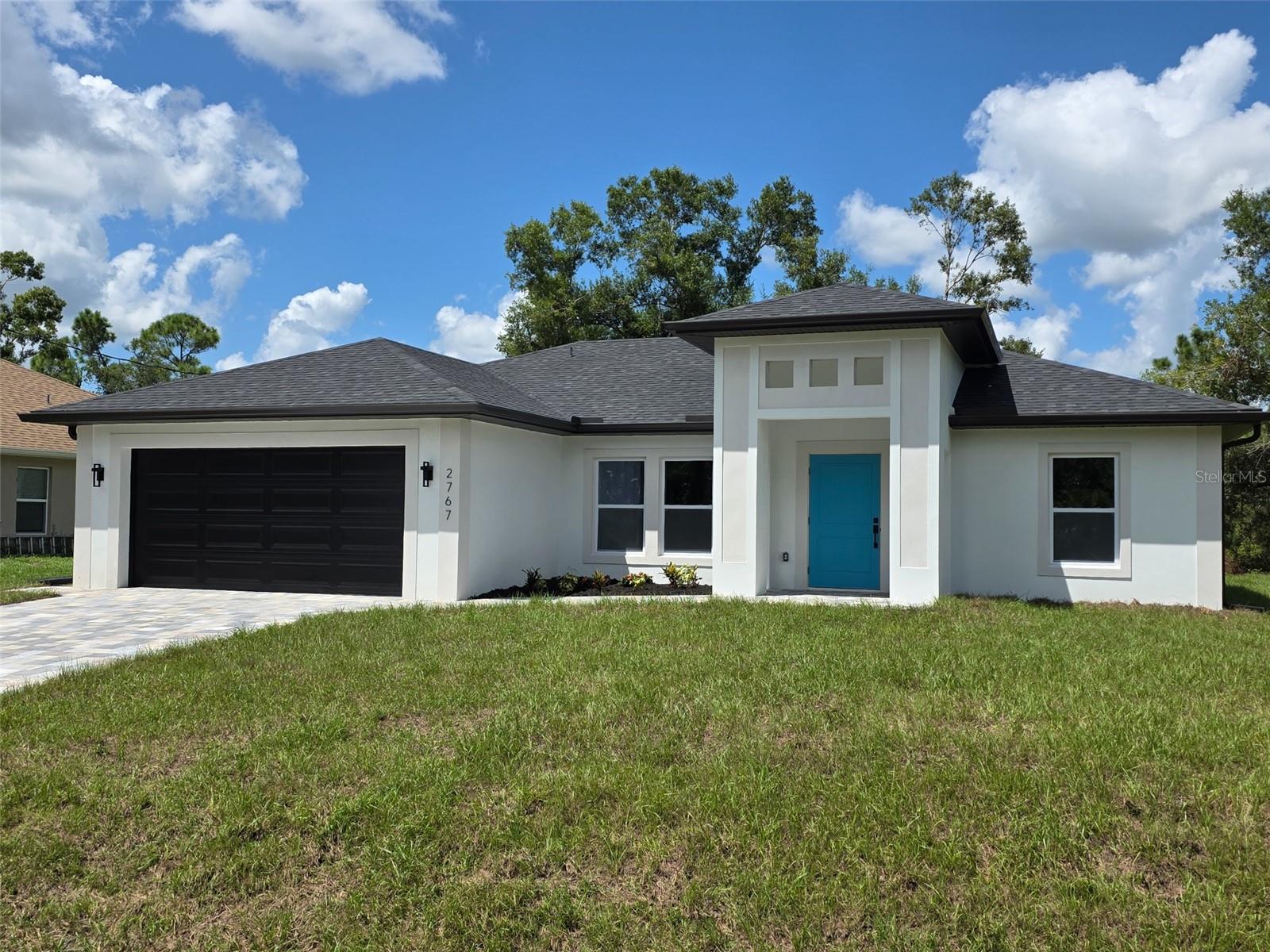 Just FINISHED -- Truly a Custom home loaded with luxury modern finishes at an affordable price on a beautiful lot with mature trees! -- NOT IN A FLOOD ZONE. Premium upgrades throughout! Immaculate finishes and design! Impact Oversized 42 inch Front Door! Paver Driveway, HUGE Lanai with outdoor kitchen hookup ready. Inside you're greeted with a Beautiful kitchen with under-cabinet lighting, quartz counters, modern sink, Kraus Kitchen Faucet, premium dark stainless appliances, 36 Inch Tall Upper Cabinets for maximum Storage, custom tiled backsplash, built in trash cabinet. Luxury Waterproof Plank flooring throughout! Beautiful tile work in bathrooms, Floor to ceiling tile accent wall in Guest Bath, and Custom tile accent wall in Master Shower, Delta Plumbing Shower fixtures, built in TILED fireplace in living room, Tall tray ceilings in all rooms, impact windows and doors. Attic and soft close insulated attic ladder installed in garage! Rain Gutters all Around, Modern Sand finish stucco. No HOA or CDD and a beautiful clean well kept area with new homes all around. Why wait to build. Move in now! Convenient location just off Atwater Dr, just a few minutes to I-75, shopping, Wellen Park and Port Charlotte plazas all super close, schools, parks, and world famous beaches all nearby! This TURN KEY Home can be yours! Beautiful custom home with a great open concept floor plan. Come see this home today before its gone!