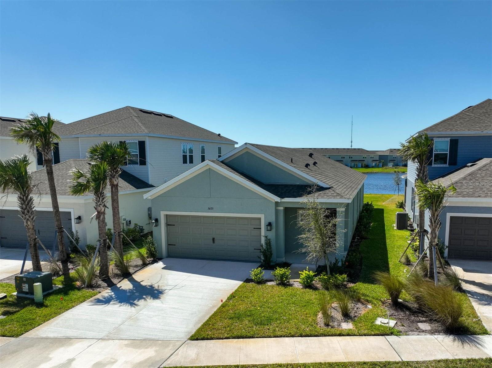 **NEW, Move-In Ready, WATER VIEW Home (built in 2024)** Offering 3 BEDROOMS, 2 FULL and 1 HALF BATHS plus 2-CAR GARAGE. This LIGHT and BRIGHT Single-Story residence features high ceilings, tray ceilings, beautiful tile floors throughout, a well-equipped Chef’s Kitchen with Granite Counters, solid wood cabinets and Stainless Steel Appliances including Natural Gas Range. Primary bedroom suite with large walk-in closet, primary bath with dual vanities and expansive, custom-tiled shower. With its Ideal Southwestern Exposure, Enjoy Tranquil Water Views in your Screened Lanai with covered seating area. Flood Zone “X” (best case scenario). PALMERO is a boutique Taylor Morrison community with amenities including sidewalk, Resort Style Pool, Spa and Splash area, Playground, Dog Park, ½ court Basketball and Grill. This community offers easy access to I-75, area Beaches including #1-rated Siesta Beach, Shopping, Downtown Sarasota and Venice cultural venues, and all that Florida’s Gulf Coast Living has to offer. **MUST SEE!**