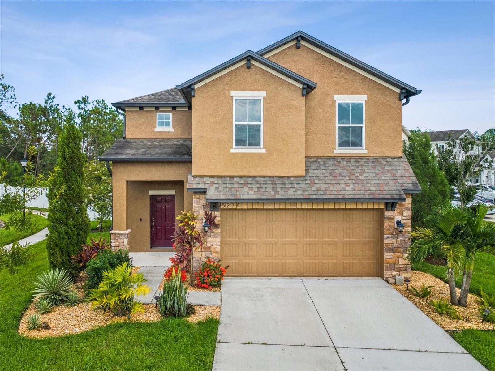 Experience Privacy, Style & Resort-Style Living in Wesley Chapel! Welcome to Avalon Park West, a warm and inviting community in the highly desirable Wesley Chapel area. This beautifully designed two-story home offers 4 spacious bedrooms and 2.5 bathrooms, blending comfort, style, and functionality for today’s modern lifestyle. Step inside to an open-concept layout that’s perfect for both everyday living and entertaining. The gourmet kitchen, granite countertops, stainless steel appliances, and an oversized kitchen island are ideal for casual meals or simply gathering around with your family and friends. Your primary suite is a private retreat, featuring a relaxing garden tub, a separate shower, and a generous walk-in closet. Additional conveniences include a walk-in laundry room and a two-car garage for ample storage. This property is situated on a premium cul-de-sac corner lot with peaceful wooded views and no rear neighbors; this property offers unmatched privacy. Enjoy the outdoors under a covered lanai with elegant pavers, the perfect spot to watch the sun rise or host evening get-togethers. This home isn’t just a place to live, it’s a lifestyle, with access to resort-style amenities and a welcoming neighborhood atmosphere. Don’t miss your chance to own this perfect combination of elegance, comfort, and tranquility in Avalon Park West!