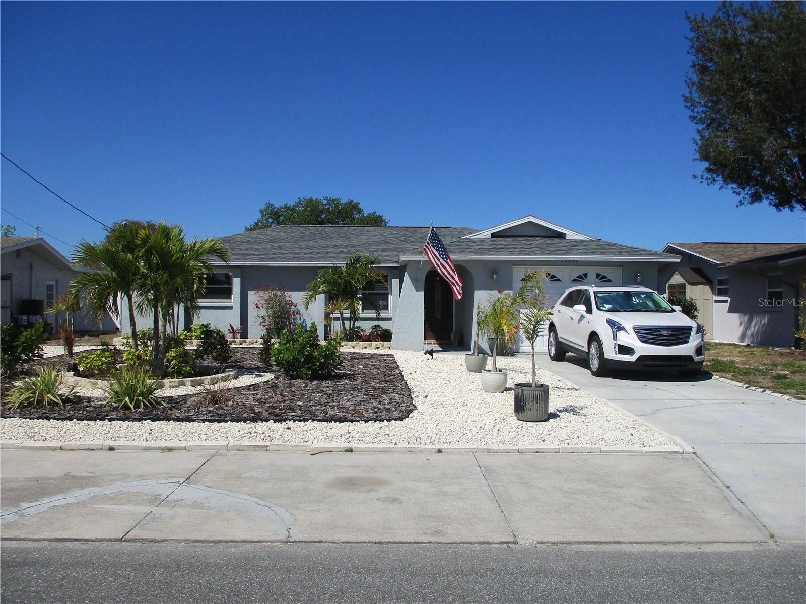 DIRECT GULF OF MEXICO ACCESS, MOVE IN READY, TOTALLY UPDATED 2 BEDROOM AND 2 BATH HOME !!! Wow! no HOA FEES, NO CDDs.. with a panoramic water view from all areas of this magnificent waterfront home with NO FIXED BRIDGES. This unique home was COMPLETELY UPDATED ON 2019; NEW ROOF. NEW AIR CONDITIONER. NEW STAINLESS-STEEL APPLIANCES, NEW GRANITE KITCHEN ISLAND W/ BUILT IN CABINETS AND COUNTERTOPS. REWIRED TO 200 AMP. NEW 6 FOOT PRIVACY FENCE. IMPACT HURRICANE WINDOWS. NEW HOT WATER HEATER. NEW LANDSCAPING, NEW DRIVE ON BOAT LIFT - up to 21 foot boat that uses a ballast tank to sink to drive on then raise the boat out of the water. NEW GARAGE DOOR, UPDATED BATHS, recently all interior painted, and new water softener, furniture is optional. This home is centrally located near all Major Hwy's, hospitals, medical, shopping mall, and of our a short drive to Hudson Beach and Sun West park and beach.