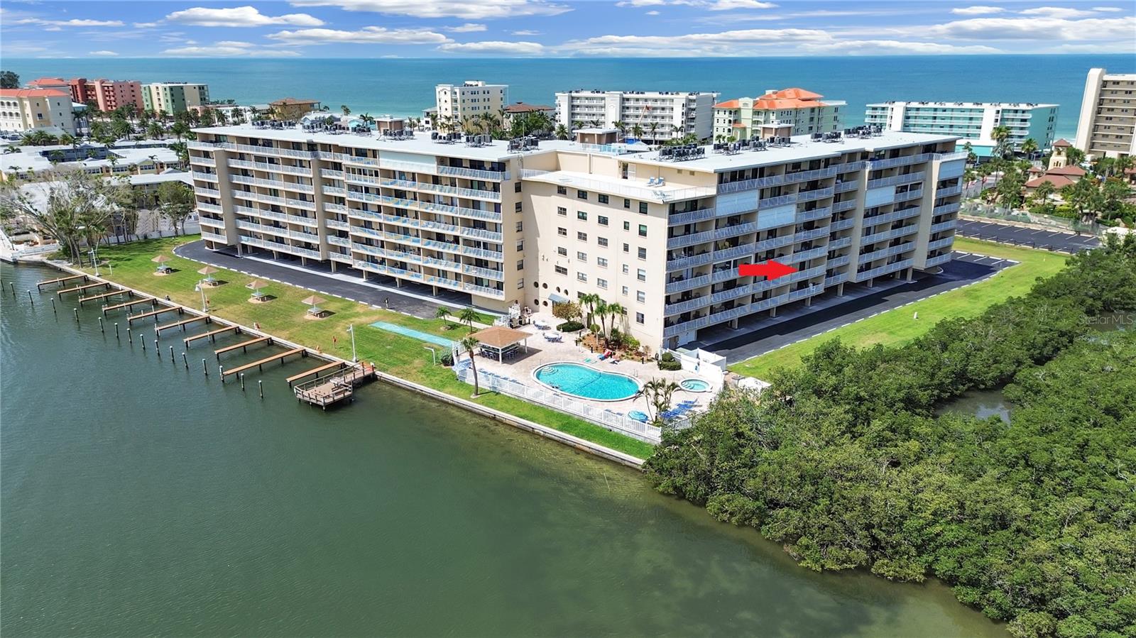 Welcome to your perfect Florida retreat! Live the beach life at BAY SHORES YACHT & TENNIS CLUB in beautiful Indian Shores Beach. This UPDATED and fully furnished 2-bedroom, 2 bath condo is move-in ready and perfectly situated on the second floor, just around the corner from the elevator, trash chute, Fitness Center (available for membership) and laundry room for added convenience. Located directly across the street from public beach access, with a pedestrian crosswalk and beach trolley stop right out front, you’ll enjoy easy access to the pristine sugar-sand beaches and all the nearby restaurants, shops, and coastal attractions. The condo features beautifully updated kitchen and bathrooms, complete with neutral interior decor, granite countertops and modern finishes that blend comfort and style. A spacious private balcony offers serene views of the mangroves and Intracoastal Waterway, the perfect place to enjoy your morning coffee or unwind at sunset. Inside the community, you'll find everything you need to enjoy the Florida lifestyle year-round. Spend your days lounging by the heated pool, relaxing in the jacuzzi spa, or grilling out in the cabana area, all set in a lush, resort-style setting. Take in the stunning views from the large rooftop sundeck or unwind with a good book after a morning of fishing off the community pier. For boating enthusiasts, there are first-come, first-serve overnight boat slips available. Active residents will love the lighted tennis and pickleball courts, shuffleboard, putting green, and optional membership to the on-site fitness center. There are also separate men’s and women’s saunas, designated storage areas for bikes, kayaks, and paddleboards, and a spacious hospitality room for social gatherings and events throughout the year. This property is ideal for anyone seeking a full-time home, vacation getaway, or income-generating investment, with a flexible 7-day minimum rental policy in place. Whether you're looking to relax or explore, Bay Shores Yacht & Tennis Club offers the best of coastal living in one of the Gulf Coast’s most desirable locations. Don’t miss your chance to own a slice of paradise in one of Indian Shores’ most sought-after communities!