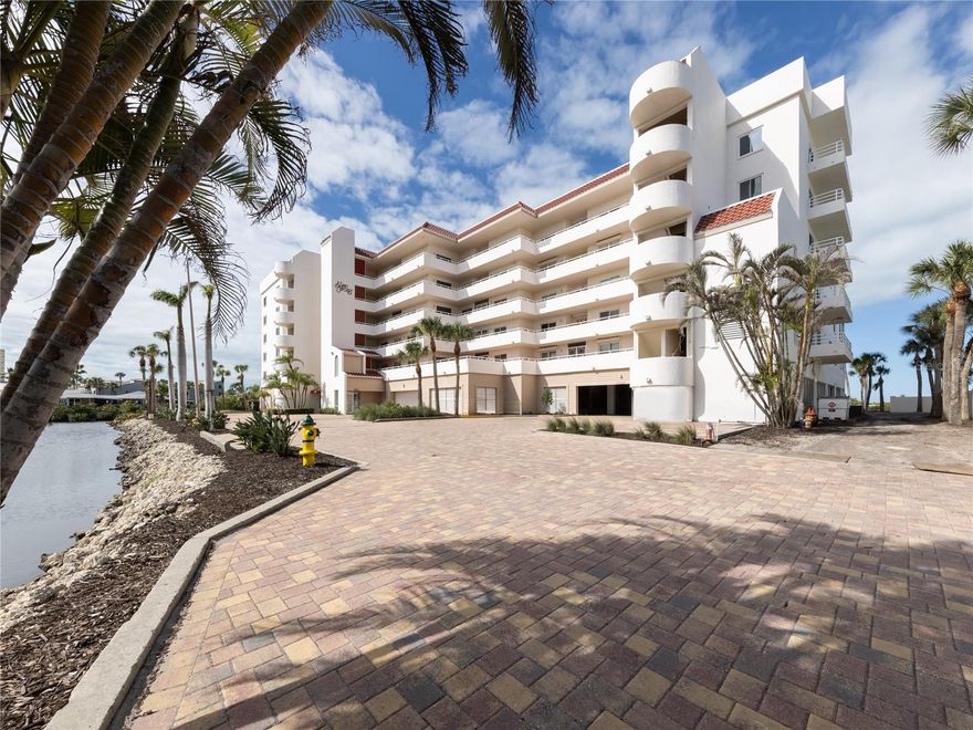 Rarely does a beachfront condominium offer this remarkable combination of spaciousness, comfort, and refined coastal living. Residence 301 at Island Shores Condominiums encompasses 2,387 square feet under air and 2,711 total square feet, presenting a rare opportunity to enjoy the scale and livability of a home with the ease and convenience of condominium ownership.
Designed for those who desire a primary coastal lifestyle without compromise, the expansive floor plan offers generous living spaces, abundant storage, and the flexibility to comfortably entertain family and friends or simply relax in everyday luxury. A gracious foyer sets the tone, offering an inviting space for an entry bench and the display of a favorite art collection before opening into a bright and beautifully scaled great room. Here, the living and dining areas are enhanced by sweeping beach views, natural light, and an open layout that feels both welcoming and sophisticated. A spectacular enclosed lanai stretches the full length of the residence and serves as an impressive Florida room, thoughtfully fitted with hurricane-impact windows to create additional year-round living space. With access from both the great room and the primary suite, this stunning area is the perfect place to enjoy morning coffee, evening conversation, or simply unwind while taking in the beauty of the Gulf and unforgettable sunsets.

The kitchen is both functional and timeless, featuring white cabinetry, white Corian countertops, and a neutral gray-toned decorative backsplash that provides subtle style while maintaining a clean and versatile palette. A charming breakfast nook overlooking the balcony creates a lovely setting for casual dining, and the large pantry and utility closet add valuable convenience and storage. Tile flooring flows throughout the main living areas, while luxury vinyl flooring in the bedrooms adds warmth, durability, and comfort.

The oversized primary suite is a peaceful retreat, offering breathtaking beach views, private access to the enclosed lanai, a large walk-in closet, and a spacious en-suite bath with double vanities, a garden tub, walk-in shower with bench and safety bars, and a private water closet. The desirable split-bedroom floor plan ensures privacy for owners and guests alike, with two additional generously sized bedrooms, one with its own balcony for enjoying outdoor space and the other positioned adjacent to the second bath, creating the feel of an en-suite guest retreat. Spacious rooms and plentiful storage throughout and all hurricane impact windows and sliders, further enhance the home’s livability.

Set in a quiet beachfront location, residents of Island Shores enjoy a relaxed and friendly atmosphere with amenities that include a pool, open patio gathering space, and a new fire pit where neighbors come together for sunset happy hours and evening conversation. The clubhouse is currently being renovated and once completed, is expected to offer a guest suite for overflow visitors, a fireplace, and beautifully improved gathering spaces. Additional features include under-building garage parking to protect your vehicle from the elements, abundant guest parking, a secure building, and recent improvements to the elevator.
Located on historic Venice Island, where charming boutiques, exceptional dining, live theater, and a vibrant arts scene are just moments away.