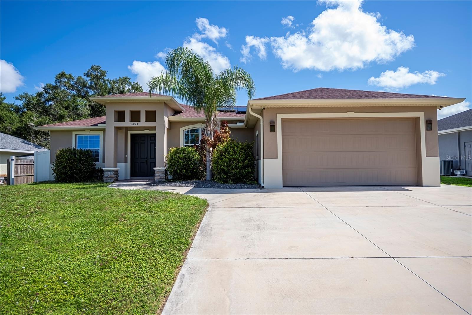 SOLAR SAVINGS! Discover the perfect blend of luxury and functionality in this spectacular 2019 custom-built home. Boasting 3 bedrooms and 2 bathrooms, this residence also features a spacious 2-car garage and a PRIVATE FENCED YARD—ideal for both entertaining and relaxation. The beautiful curb appeal welcomes you into a soaring entryway and a formal foyer, setting the tone for the elegance that awaits inside.Step into an open floor plan that seamlessly integrates exquisite custom wood and tile flooring throughout, creating an atmosphere of modern elegance. The luxurious living room showcases a recessed ceiling and offers a theater-like experience with a stunning built-in stone wall fireplace—perfect for cozy gatherings. The chef-worthy kitchen is a culinary dream, complete with abundant cabinetry, granite countertops, a stylish tile backsplash, and fingerprint-less stainless steel appliances. Additional highlights include a pot filler, a fully vented range hood, a breakfast bar, elegant pendant lighting, and a walk-in pantry. The separate dining room, adorned with French doors, opens up to a serene patio and private backyard, enhancing your dining experience.Retreat to the spacious master bedroom, filled with natural light, featuring an ensuite spa-like bath and a substantial walk-in closet, complemented by updated lighting for a touch of luxury. The two guest suites are thoughtfully appointed, sharing a modern bath in this well-designed split plan layout. Additional amenities include, electric car charger in garage, a whole-house reverse osmosis water filtration system for exceptional water quality, a central vacuum system, hurricane-rated impact doors and windows, and convenient inside laundry. With no HOA fees and being located outside a flood zone, this home offers both freedom and peace of mind. Plus, there’s room for a pool, adding extra convenience and value. North Port has Myakka State Park and Myakkahatchee Creek Environmental Center Park with miles of great trails, horseback riding, hiking, bird watching, biking, water views and access. Close to PG airport, dining, shopping, Stadium and beaches, Warm Mineral Springs and Aquatic Center. Don’t miss the chance to make this stunning home with EXCEPTIONAL SOLAR SAVINGS yours—schedule your showing TODAY!