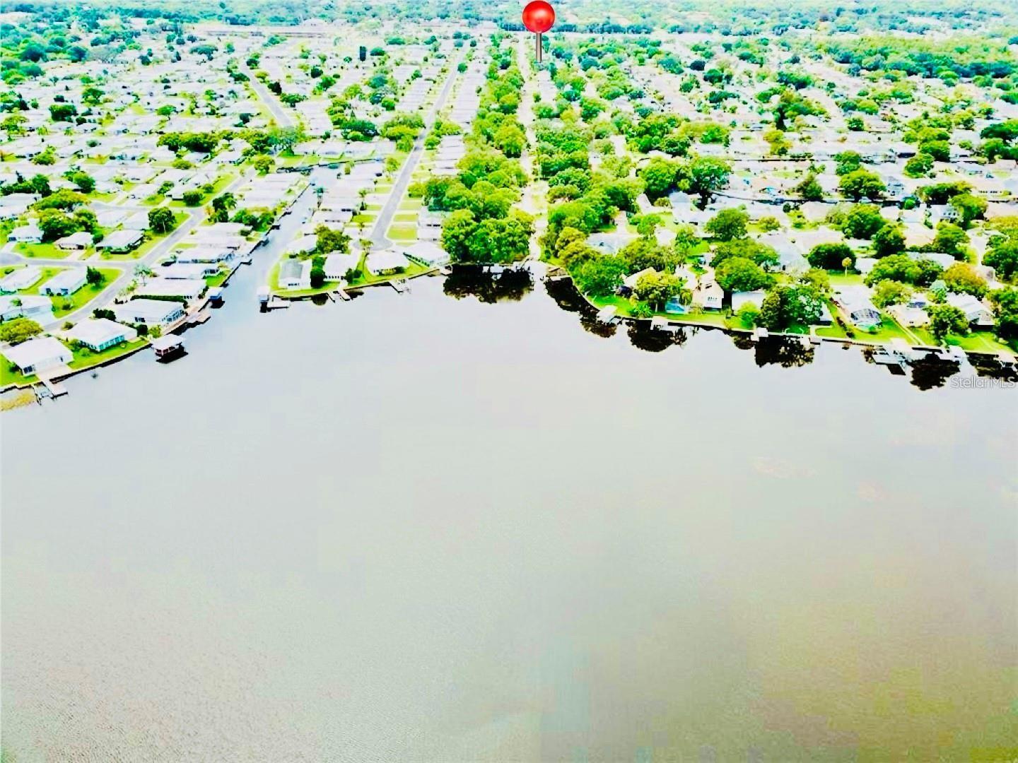This lakefront community proves that salt life is overrated! Hop off your boat after a beautiful day on Lake Tarpon and walk to your 2 bedroom 2 bath gorgeous home. Located in the boat friendly neighborhood of Lake Tarpon Estates with private neighborhood ramp and clubhouse on the lake. Great location, close to shopping (Publix, Speedway gas station and Super Walmart), Great Schools, and entertainment. Very clean and well-maintained home, truly a must see! Closet organizers with drawers, Over-sized 2 car garage (615 sq ft) nice built-in cabinets - tons of storage, great for a workshop, huge deck for entertaining. Four car extended driveway, remodeled bath with travertine and granite, remodeled kitchen with Stainless Steel Appliances, Cat-5 network run throughout home. The neighborhood features: Boat ramp to Lake Tarpon, club house on the water with private dock, park with playground, no deed restrictions, golf cart friendly & boat friendly. This rental will not last.