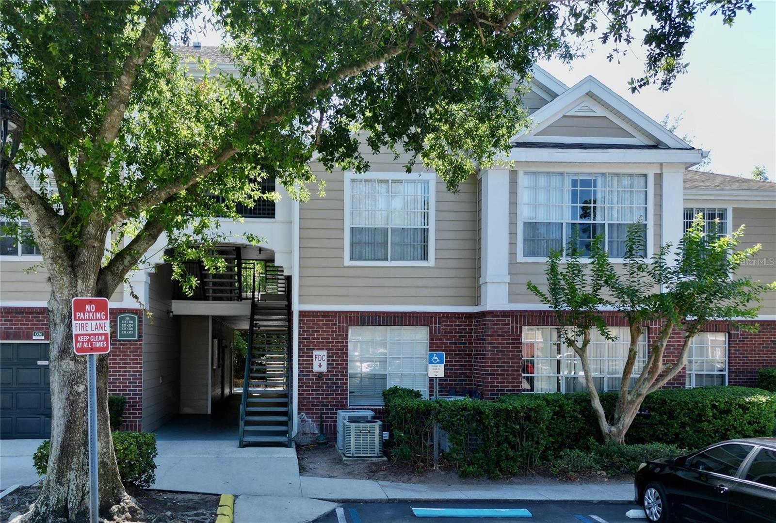 Spacious and bright 2-bedroom, 2-bath condo in the desirable Plantation Park community at 13025 Mulberry Park Dr #332, Orlando. This inviting unit offers high ceilings, oversized windows that fill the space with natural light, an open floor plan with a cozy fireplace and built-in shelving, and a fully equipped kitchen featuring stainless steel appliances, ample cabinet space, and a breakfast bar that opens to the living area. Both bedrooms are generously sized with large closets, while the in-unit laundry room provides added convenience. Enjoy resort-style amenities including a swimming pool with spa, clubhouse, fitness center, tennis and racquetball courts, playground, picnic and BBQ areas, and beautifully maintained grounds. Perfectly located just minutes from Walt Disney World, SeaWorld, and Universal Studios, as well as Orlando Premium Outlets, The Loop shopping center, dining, and entertainment. Easy access to I-4 ensures quick commutes throughout Central Florida. PETS WELCOME, making this home an ideal choice for comfortable living with a full lifestyle experience.