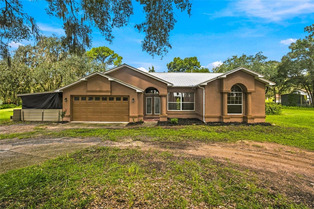 Photo of 6863 Remington Rd, Brooksville, FL 34602 (MLS # OM732915)