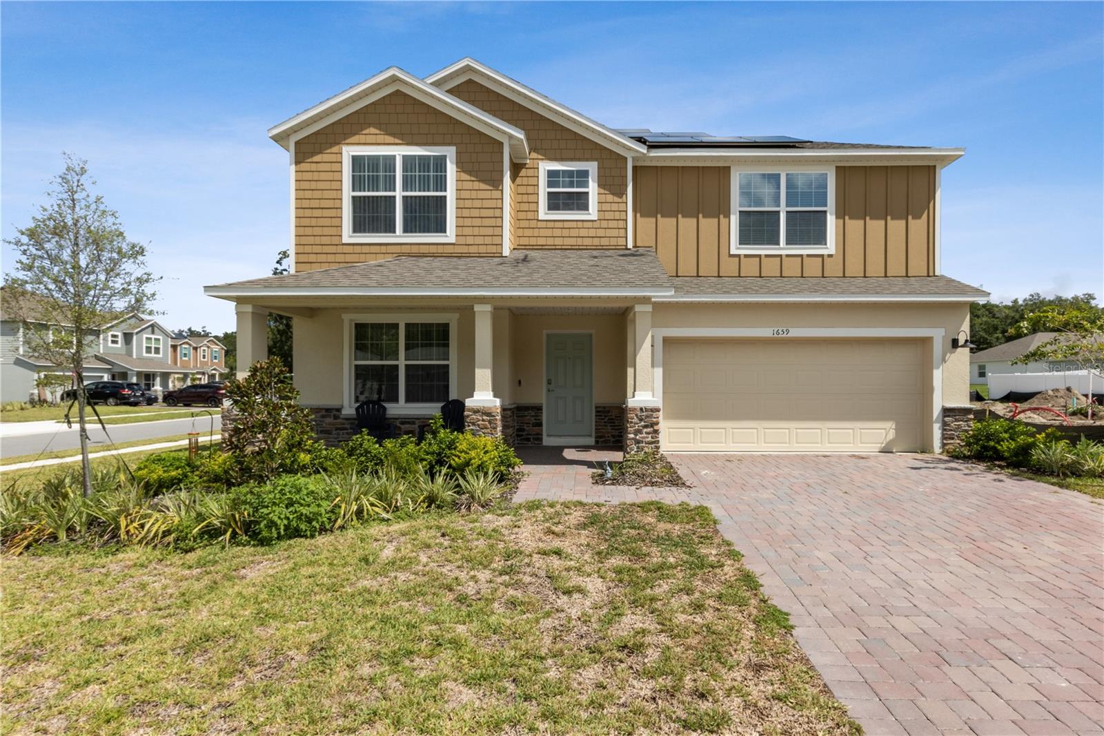 Welcome to Andover Ridge, a peaceful and sought-after community in Deland, FL, offering a tranquil residential setting with easy access to local amenities, parks, and the charming downtown area. Rare opportunity to own a Carlisle, a two-story single-family home with a 2 car garage on a corner lot!! The Carlisle floor plan features exceptional living space, engineered for optimal flow and convenience. The new kitchen boasts gorgeous quartz countertops and tile backsplash with a walk in pantry. There is also a brand new water filtration system throughout the entire house. A standout feature of the first floor is a guest suite with a private en-suite bathroom, complete with a modern shower. The second floor includes four bedrooms, with bedrooms 3 and 4 featuring their own walk-in closets. The master suite features a soaking tub, a large shower, and a huge walk-in closet. For added convenience, the full-size laundry room is located upstairs close to the bedrooms. This home is built to last, featuring architectural shingles and an added ZIP System for superior weather resistance, energy efficiency, and structural integrity. These thoughtful upgrades ensure your home will remain durable and energy-efficient for years to come. Including brand new solar panels to make living expenses super affordable. For added comfort and convenience, the home is equipped with Energy Star appliances and Energy Star windows, promoting energy efficiency throughout. Smart technology features include a Ring Video Doorbell, a Smart Thermostat for climate control, and a Keyless Entry Smart Door Lock, allowing you to control access and energy use with ease. Outside, the home is nestled in a quiet cul-de-sac, offering peace and privacy. The landscaping is beautifully maintained, and an irrigation system ensures that your yard stays lush and vibrant year-round. This popular and limited Carlisle plan is ready to be your new home. Don’t miss the opportunity to make it your own! Schedule your showing today!!