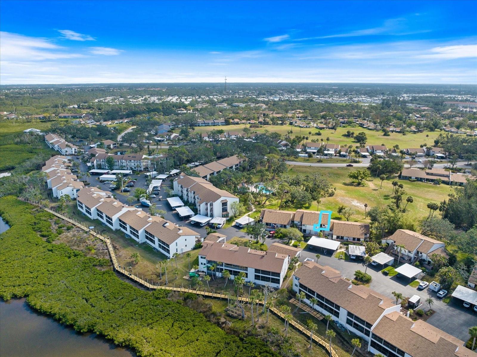 Discover Your Carefree Coastal Retreat! 
Step into this stunning, updated 2-bedroom, 2-bathroom second-floor condo in the vibrant Bird Bay Village community. With unobstructed views of the former Hawks Run Golf Course, this light-filled retreat combines modern comforts with the laid-back Florida lifestyle. 
Vaulted ceilings create a spacious, open feel, while the luxury vinyl flooring adds a sleek and durable touch. The updated kitchen is a chef’s delight, featuring stainless steel appliances, modern cabinets, and quartz countertops. Both bathrooms have been thoughtfully renovated, offering fresh, stylish finishes for your comfort. The second bedroom is currently set up as a den, complete with built-in closet space, making it a versatile space for guests, a home office, or a hobby room. The expansive screened lanai is perfect for sipping your morning coffee or enjoying evening breezes, with additional storage and a convenient laundry area tucked away. 
Resort-Style Living at Its Best Bird Bay Village is more than a community—it’s a lifestyle. With two pools, including a Junior Olympic-sized option for laps or lounging, tennis and pickleball courts, a fully equipped fitness center, and a clubhouse for social gatherings, you’ll never run out of activities. Nature lovers will enjoy the completed boardwalk overlooking Roberts Bay, perfect for sunsets and tranquil views. For outdoor enthusiasts, the Legacy Trail is right outside the community, offering miles of scenic biking and walking paths. 
Located just minutes from Venice Beach and historic Downtown Venice, you’ll have easy access to charming boutiques, delicious dining options, and world-famous Gulf Coast sunsets. This condo is truly move-in ready—all that’s missing is you! Whether you’re looking for a second home, planning to retire or just want to have your forever home in the warm Florida sunshine, this amenity-rich haven offers everything you need to live your best life. 
Schedule your private showing today and discover why every day feels like a vacation in Bird Bay Village!
