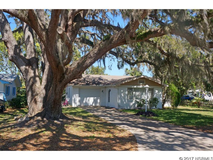 Live in a perfect cottage just steps from Riverside Dr between US 1 and the river and near the Edgewater/New Smyrna Beach city limits. Shaded by a century-old oak tree, this 1960s home was built of block with original Terrazzo floors and has been immaculately maintained by the same owner for 27 years. There are two bedrooms and two full baths - one is located in the garage and the kitchen has granite countertops. Walk the river path at the end of the street and enjoy the tropical paradise. This is a perfect retreat at the beach! ;Water: City