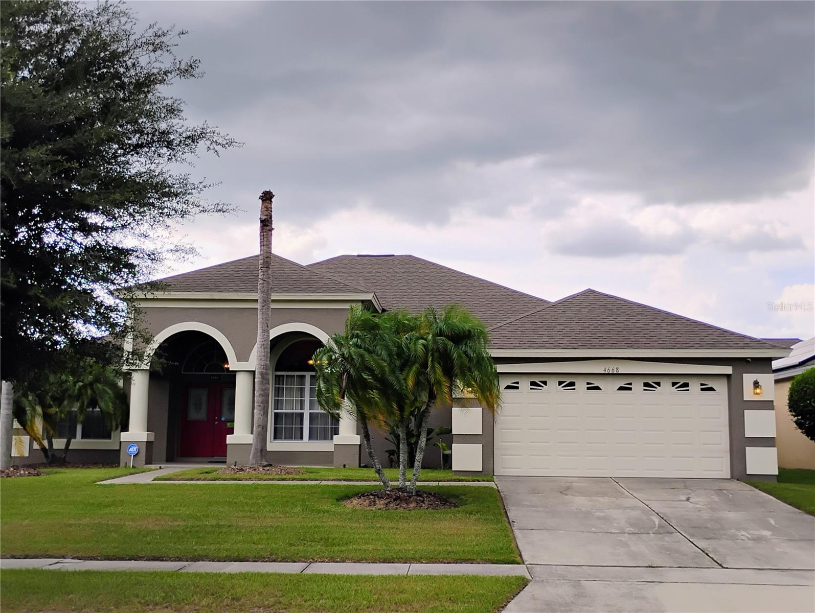 Large screened in Pool Home with under roof lanai and fenced in back yard. Enjoy the bright Florida Sun while relaxing in the hot tub or exercising in the sparkling cold blue pool. LOW HOA and NO CDD with a tranquil pond view from the front of the home. This contemporary home boasts Tall Ceilings, split plan Bedrooms, Open Plan yet Formal Dining, Living room and a great floor plan. Master Bedroom, Living room and Guest Bathroom has exterior doors leading to the Swimming pool entertainment area. The Kitchen has a separate eating nook, a breakfast bar and a nice size pantry. Master Bedroom is a large and the Master Bathroom has an oversized Shower. Come see the potential this home has to offer.