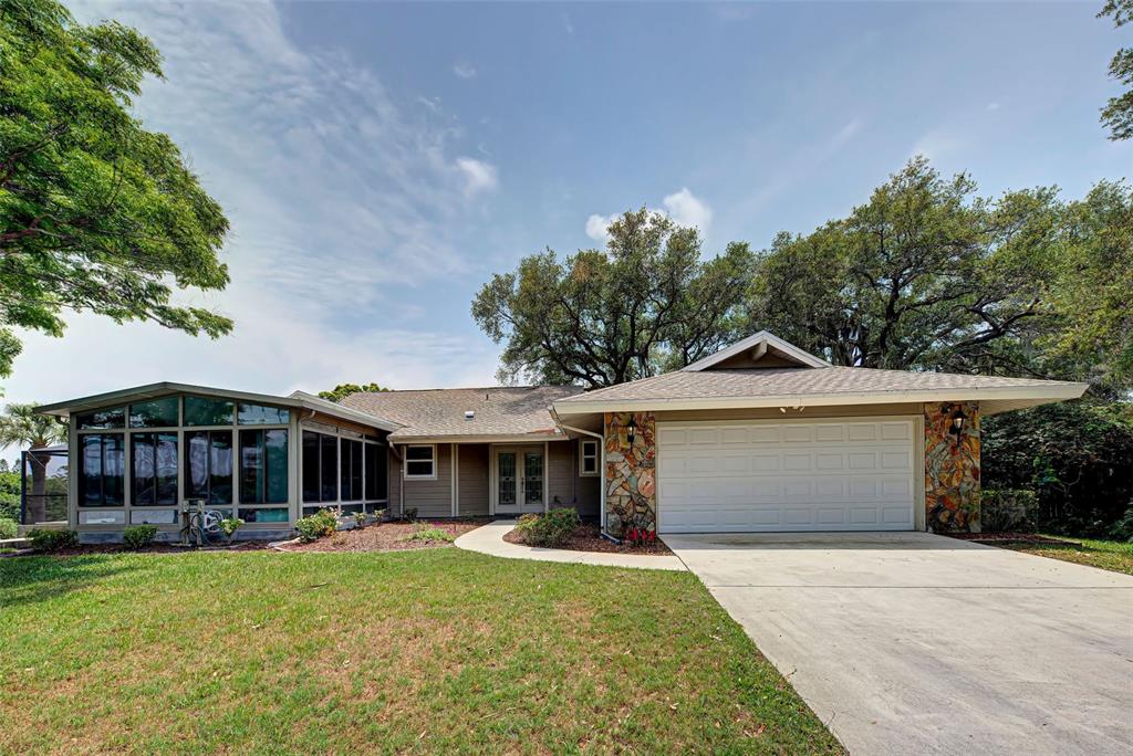Rented for the 2026 winter season. This beautifully landscaped lake front home is where you will want to spend your winter vacation! Situated on Mirror Lake in the heart of Sarasota near Palmer Ranch, this lovely 2 bedroom, 2 1/2 bath home + sunroom offers a quiet and peaceful sanctuary as you sit by the pool with a good book and look out onto a 10 acre lake surrounded by beautiful trees and an occasional visit by a Bald Eagle! Wake up every morning in the Master Bedroom to the beautiful sunrise over the Lake! In the sunroom, you will find 2 sofas, one with a Queen pull out memory foam mattress for overnight guests. This can function as a 3rd bedroom as it has French doors, window shades and a separate cooling system. The Master bedroom has a a new Tempur-Pedic King mattress. The Guest bedroom has 2 full size Trundle beds. A walk-in shower in the Master Bathroom and a tub/shower in the Guest bathroom. The open concept kitchen is complete with stainless steel appliances and beautiful granite counter tops. Full size stackable laundry appliances in the laundry room next to the kitchen.
The home has 18" tile throughout with no carpeting. The oversized garage has a workshop and outside, a lovely back yard patio surrounded by mature Oak trees.
What a treat to take a swim in the 6 ft. deep saltwater lap pool (4 ft. at both ends) and enjoy a relaxing soak in the hot tub after a full day of sightseeing and enjoying all that Sarasota has to offer....Beaches, (Siesta Key Beach is just 15 minutes away - 5.7 miles!), Sarasota's finest shops and restaurants, Sarasota Opera, Ballet, and the Sarasota Symphony. All utilities are included during the prime season months of December through April. Owner has placed a $250 cap on the monthly electric bill during the prime season.
Off-season guests pay the monthly electric bill.