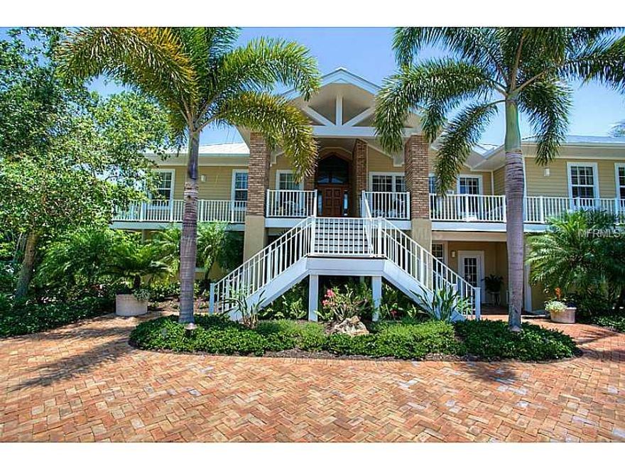 The ultimate "husband and wife" property - she gets her beach and he gets his dockage! This completely remodeled/renovated (inside and out) home sits on pristine waterfront and Gasparilla Pass front beach. The home features 4 bedrooms, 3 baths in 3,500 +/- sq. ft. of living area, along with 5,000 +/- sq. ft. of bonus rooms, decking, covered/enclosed decking, storage, garages, etc!  The sparkling backyard pool faces the water and a raised boardwalk takes you out to the dock and beach.  The 2005 renovation/remodel essentially added nearly all new everything! Features including: Anderson doors and windows with impact (Hurricane) glass, Hardy plank exterior siding, Azek composite trim, standing seam metal roof with secondary moisture barrier membrane, 2 converted gas fireplaces, top-of-the-line kitchen, resurfaced pool, new spa, elevator added, seawatch roof deck added, and an excellent dock with 14,000 &  7,000 lb. lifts. A beautiful Hazeltine landscape highlights the property with irrigation, surround lighting and attractive brick paving. This could very well be the home you have been waiting to see ... Come take a look!