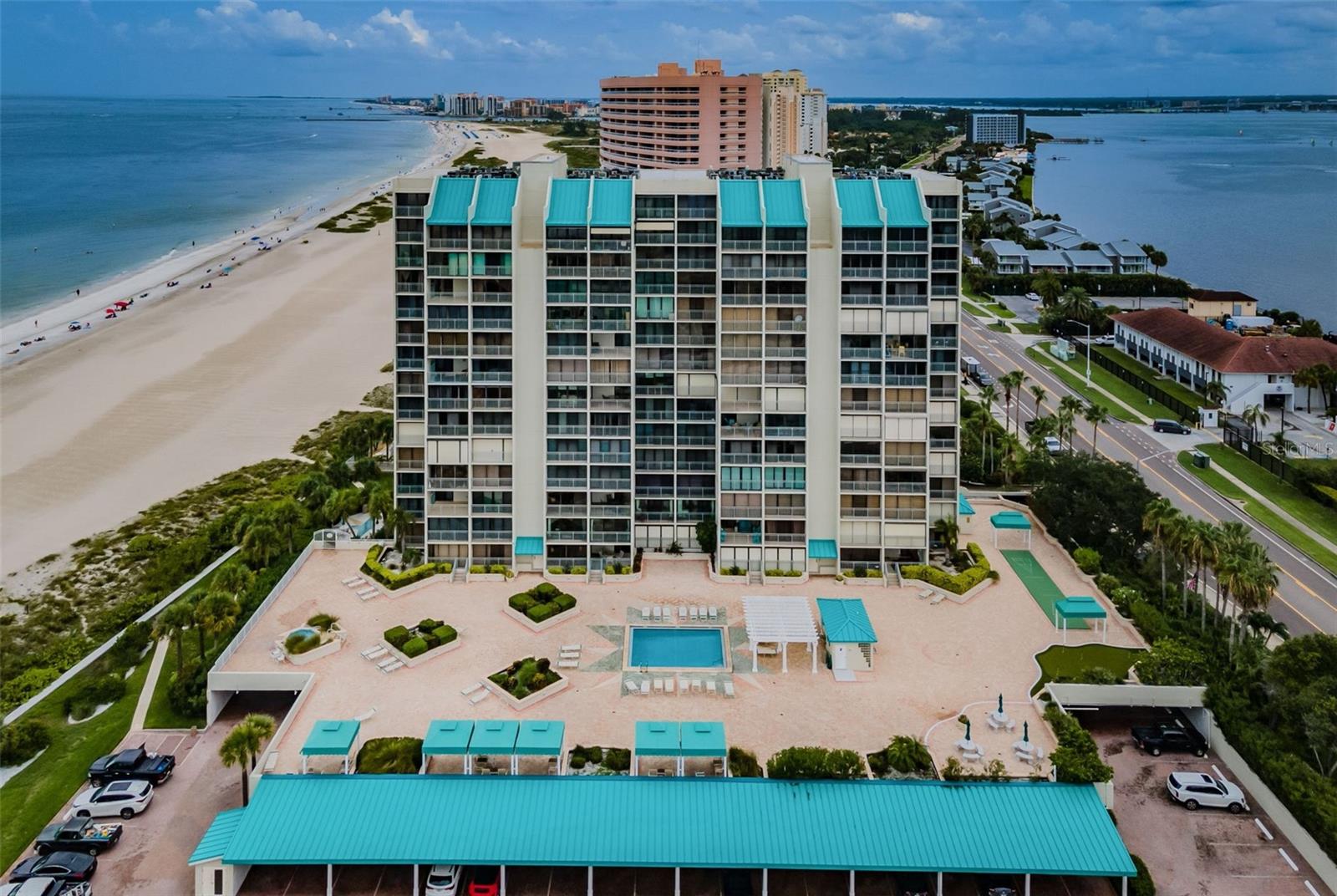 TWO LEVEL PENTHOUSE with separate MOTHER IN LAW SUITE. This South Facing Penthosue features: Two Separate Master Suites, Spacious Bedroom, 3 1/2 Baths and Separate Office and Laundry Room. World Famous Sand Key Club located in CLEARWATER BEACH, Home of the SUGAR SANDS. LOCATION, LOCATION, LOCATION. This Pristine Penthouse is located on the 14th and 15th Floors with SOUTHERN EXPOSURE and Panoramic Views of The Gulf of America and Clearwater Bay, The Intracoastal Waterways has NEVER ENDING SUNSETS AND SUNRISE VIEWS. Enjoy the Beachside BBQ Area while you listen to the rhythmic waves rolling up on the shore while the Gulf Breezes are flowing by. Only the Sand Key Club has its HOTELLIKE LOBBY including ATTENDANTS on alert 24/7. Amenities include Club Room, Gym with Baths and Showers and Sauna. The Elevated Plaza Deck featuring Pool with Spa and Cabanas, Putting Green and Shuffleboard. The Sand Key Club is 30 minutes from both airports and has the Jolly Trolley Bus stop out front to take you to John's Pass, Tarpon Springs and everywhere in between. Sand Key Shoppes and Restaurants are in walking distance as well as the Water Sport dock located behind the Marriott Hotel next door to the Shoppes. You are at the right place because, WE'VE GOT THE BEACH!