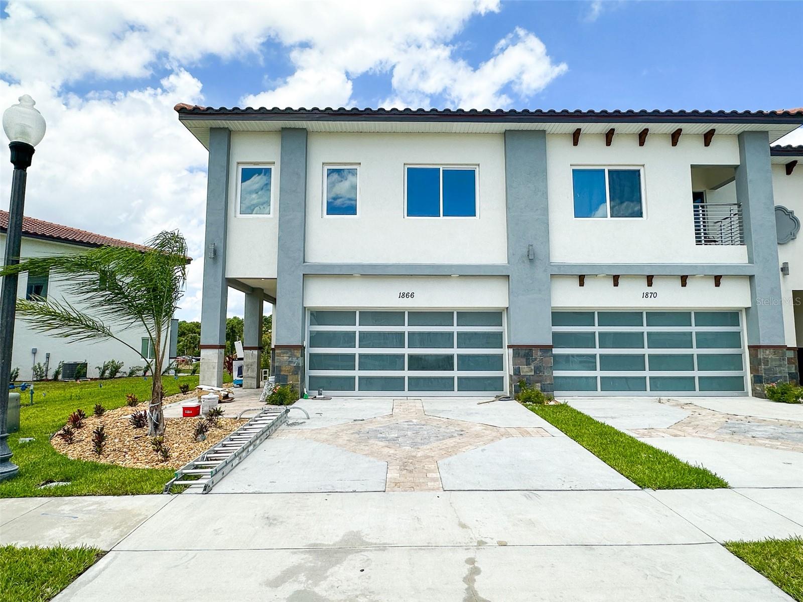 Beautiful 4-bedroom townhouse situated on a corner lot with a stunning water view. The home features four spacious 4 bedrooms, 2.5 bathrooms, and a 2-car garage with glass doors. Upon entering the first floor, you're greeted by an open layout with abundant natural light. The kitchen is a modern marvel with a waterfall granite countertop, marble look backsplashes, and sleek 42" multi-level European design cabinetry with soft open and slow close functions. It includes frosted glass cabinet doors with interior lighting, a gourmet kitchen, and a built-in stainless steel appliance package featuring a combination microwave, stove, range hood, dishwasher, and countertop refrigerator with an ice maker. There's also a built-in wine cooler and a designer faucet with a removable sprayer. Upstairs, the master bedroom features a tray ceiling with lighting and a stunning balcony to enjoy the views. The en-suite master bathroom is spacious and luxurious, with a freestanding tub, granite countertops, under-cabinet lighting, double sinks, a tiled shower, and a walk-in closet. The remaining three bedrooms are generously sized and share an additional bathroom with a full shower and double sinks. Conveniently situated in the gated community of Providence, this unit offers proximity to a range of amenities, including a playground, an 18-hole Michael Dasher-designed golf course, a pro shop, daily lunch service at the on-site restaurant, tennis courts, and both lap and resort-style pools. Washer and Dryer and blinds will be installed. Lawn care is included.