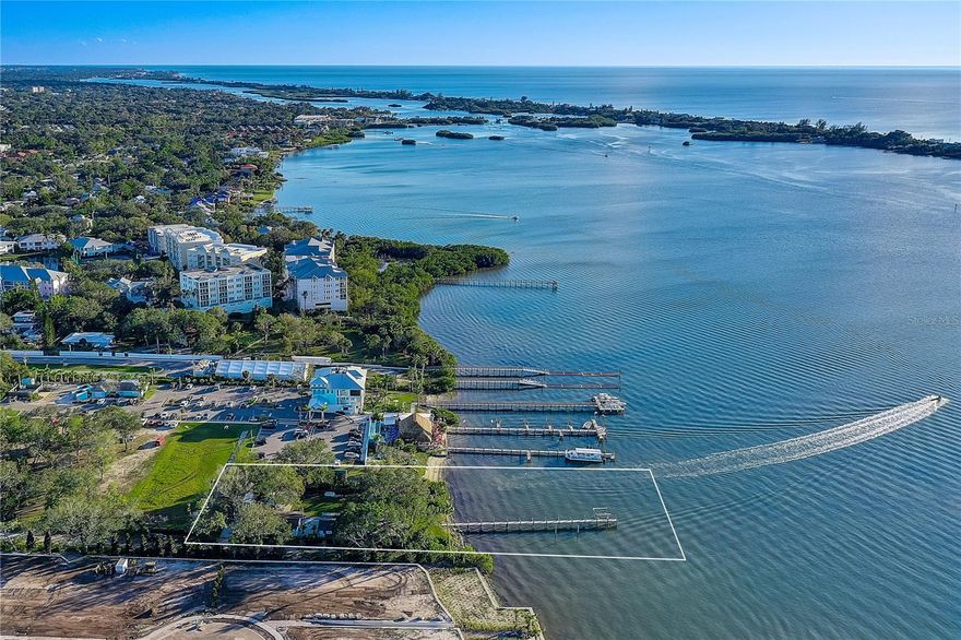 This half-acre parcel boasts 100 feet of pristine bayfront land, zoned RMF1, offering significant development potential.
