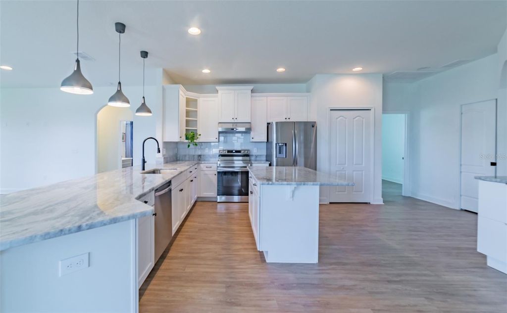 Photo of 570 Sanctuary Boulevard, Winter Haven, FL 33881 (MLS # S5142747)