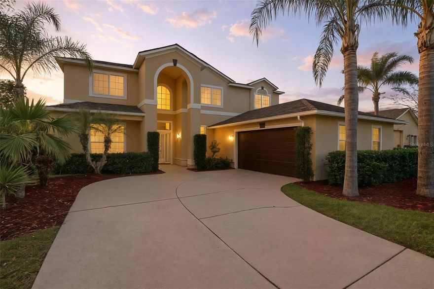 This beautiful 2-story home in the gated community of Stoneybrook Hills offers plenty of living space, curb appeal here is outstanding – boasting landscaped garden beds, palm trees and a side-entry garage. 
Inside the front door, you’ll find soaring ceilings, tile & hardwood floors, crown molding, a unique double-sided stairway and plenty of natural light. 
The open kitchen features granite countertops, stainless steel appliances, rich cherry cabinetry, an island and a long breakfast bar overlooking the dining area. The family room anchors the rear of the floorplan, with a cozy corner fireplace and a big slider that leads out to the back patio. The huge fenced-in backyard has room for your garden, playscape or future pool.  
Back inside, the main level includes one bedroom and a full bathroom – perfect for in-laws or guests. Head upstairs to find the rest of the bedrooms (ALL hardwoods) and a BONUS loft area that could be a playroom, second living room or homeschool headquarters. The spacious primary bedroom offers tray ceilings & two walk-in closets, while the ensuite has granite-topped double vanity, a W/C, a jetted tub and a large corner shower. The guest rooms on the other side of the floorplan share the hallway bathroom with double sinks. Large second floor walk-in closet (can be converted back to 5th bedroom). 
Don’t forget about the newer roof (‘23) & water heater (‘23), plus the convenient laundry room/drop zone between the attached garage and the kitchen. 
The 24-hour gated community of Stoneybrook Hills is dotted with mature oak trees and offers residents amenities like a playground, Olympic-sized pool, a fitness center, clubhouse, jogging/bike paths and basketball/tennis/pickleball courts. You’ll be close to all the shopping & dining along 441, with the lakefront & historic Mt. Dora just a few minutes from your front door. It’s also an easy drive to Sanford, downtown Orlando and all the theme parks. Come see this exceptional move-in-ready property today!