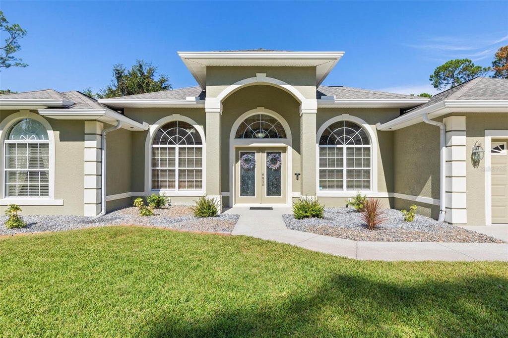 Photo of 75 Brushwood Lane, Palm Coast, FL 32137 (MLS # FC321804)