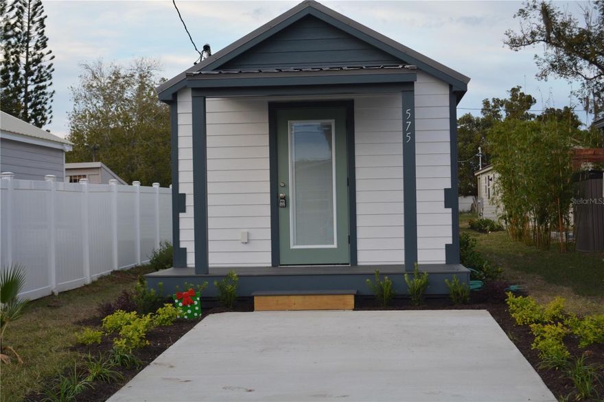 Homebuyers will increasingly look for smaller homes as a more sustainable, affordable and desirable way to live .  No HOA fess you own your lot. Lets keep it Cozy. Tiny House square footage 432 SQUARE FEET ( the Squire Model )  One bedroom *  One Bath * laundry in the bathroom * 36 inch shower is standard *  INCLUDES LOT, HOUSE, DELIVERY and all STIE WORK *  Other models on different lots * this is lot 32 *  All appliances including the stackable washer and dryer * tankless hot water heater * Vinyl/Plank flooring * lot is level * close to the Lawton Chiles, Jackson Heights and Oviedo High School * ready to downsize * use as a Rental or and Airbnb * close to the Grocery Stores in two directions * new construction all around * there are now ten tiny homes in this same location. Seller offering up to $10,000.00 incentive toward buyer rate buydown or closing costs.