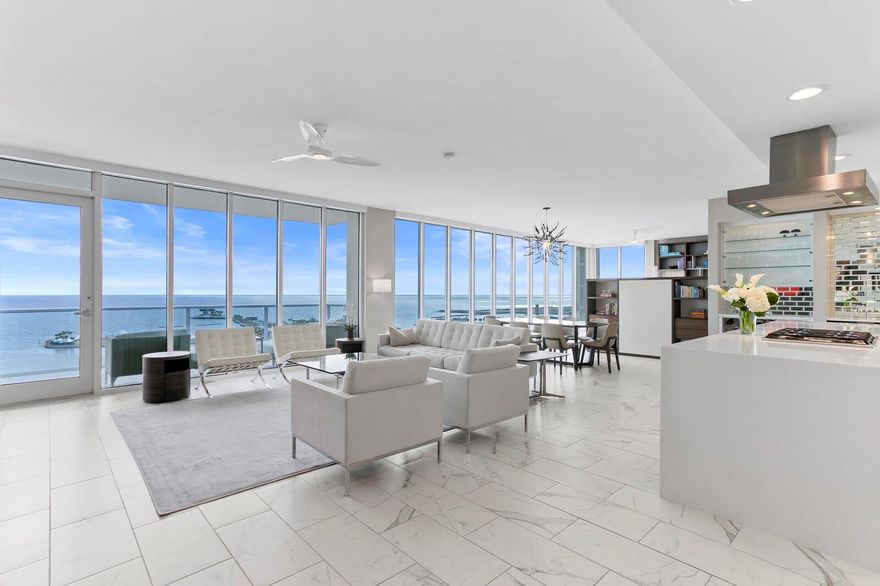 Welcome to ‘the Best View in St. Petersburg’ at Bliss Condos #1602. This one-of-a-kind residence is owned by an award-winning architect who has created a total transformation and made improvements that set it apart from the rest of the Bliss Condos. Part of what makes this 2-bedroom, 2.5 bathrooms plus a den so unique is that the primary bedroom has been relocated from the east side to the west side, showcasing an impressive 44 feet of floor to ceiling glass with unobstructed panoramic views overlooking Tampa Bay, the St Pete Pier, the Albert Witted executive airport, and the world-famous Dali Museum to the south. The former primary bedroom has been transformed into a versatile den with extensive built-ins, while the kitchen has been enlarged and enhanced, featuring a 13 foot long waterfall edge island including a 6-burner gas cooktop, upgraded Viking stainless steel appliances, and a stunning subway-titled backsplash. Additional home improvements include $150,000 worth of built-in wood cabinetry throughout the condo, a Haiku LED fan in each room, and remote-controlled roller shades throughout. Beyond the stunning interiors, #1602 offers a unique vantage point within Bliss Condominiums. Positioned at a perfect height, it rises above the city's noise and activity. Notably, this elevation provides an ideal perspective for enjoying fireworks on the 4th of July and New Year's, with the dazzling displays occurring right above the Vinoy Basin at eye level. Bliss Condos are a boutique luxury condominium building in the heart of St. Pete with only 29 residences and no shared walls. For added security and privacy, the elevator opens with your key fob, ONLY to your residence. Community features include a secured key fob access lobby, a daytime onsite property manager, two reserved parking spaces on the second floor, a first-floor heated pool area with beautiful landscaping, a fitness center, and a lighted, fenced dog walking area. Additional amenities include a top-floor sky Lounge on the 18th floor, which provides spectacular views of Tampa Bay, a 10-person rooftop spa, an outdoor community grill, electric charging stations, and more! Bliss has one of the best locations in downtown St. Pete. Across the street is North Straub Park which provides many fun events and outdoor concerts. The Vinoy Resort Hotel veranda is a local favorite for afternoon cocktails. Many restaurants are a short distance along with other waterfront parks, marinas and museums. Bliss also has easy highway access to Tampa International Airport, shopping and nightlife. Move-in ready, claim this extraordinary residence as your own today. Schedule a showing to experience the epitome of luxury downtown living.