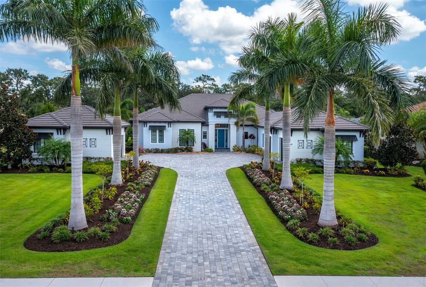Nestled on a superior and private lot in The Concession, this 2019-built coastal-contemporary dream home awaits. Built by John Cannon Homes and designed in concert with the thoughtful & creative owners, it is truly a custom masterpiece. Meticulous care was given to every aspect, from the overall design to each individual decision regarding technology, storage, comfort, and possible future needs, such as pre-wiring for security cameras and adding multiple gas stubs to the lanai for future outdoor living enjoyment. Constructed to the latest hurricane codes and featuring a natural gas-run generator, there is simply nothing to worry about so you can move on to appreciating the fine finishes and selections that make this home such a joy to occupy. Upon entry, you will be wowed by the soaring ceilings and feeling of graciousness, all softened by beautiful natural elements such as ceiling beams and warm wood built-in shelving. This home truly strikes the perfect balance of wide open and light-filled spaces, while somehow keeping a cozy feel. The magnificent kitchen is beautifully large and features an unusual and gorgeous wall of windows, plus an abundance of storage and counter space. Monogram appliances and a custom-color 48” BlueStar natural gas range will accommodate even the choosiest home chefs. The thoughtful floor plan stands out with lovely separation between each of the four en suite bedrooms, and there is so much usable space with the additional den and office/study. A convenient dedicated pool bath with an entrance right from the lanai is also a bonus. Despite the large amount of space in the home, the feeling remains warm and welcoming due to the special design features sprinkled everywhere – from interesting ceiling designs to decadent wall treatments and spectacular lighting choices, there is always something to see. Nearly 2,000 square feet of lanai space is indulgent, fabulous, and offers complete privacy, and the amount of storage here will also amaze: garage parking for 4 cars, plus a 110-square-foot air-conditioned storage closet means everything will have a place. The Concession is home to one of the most distinguished golf courses in Southwest Florida and it is the premier address for those desiring luxurious low-density living within a short drive to the amenities of Lakewood Ranch and Sarasota. While an obvious choice for the discerning golfers among us, those who don’t play will also love the social and culinary delights available with optional club membership. If the unique and gracious lifestyle of The Concession is what you desire, there is no other option…this home is absolutely it.