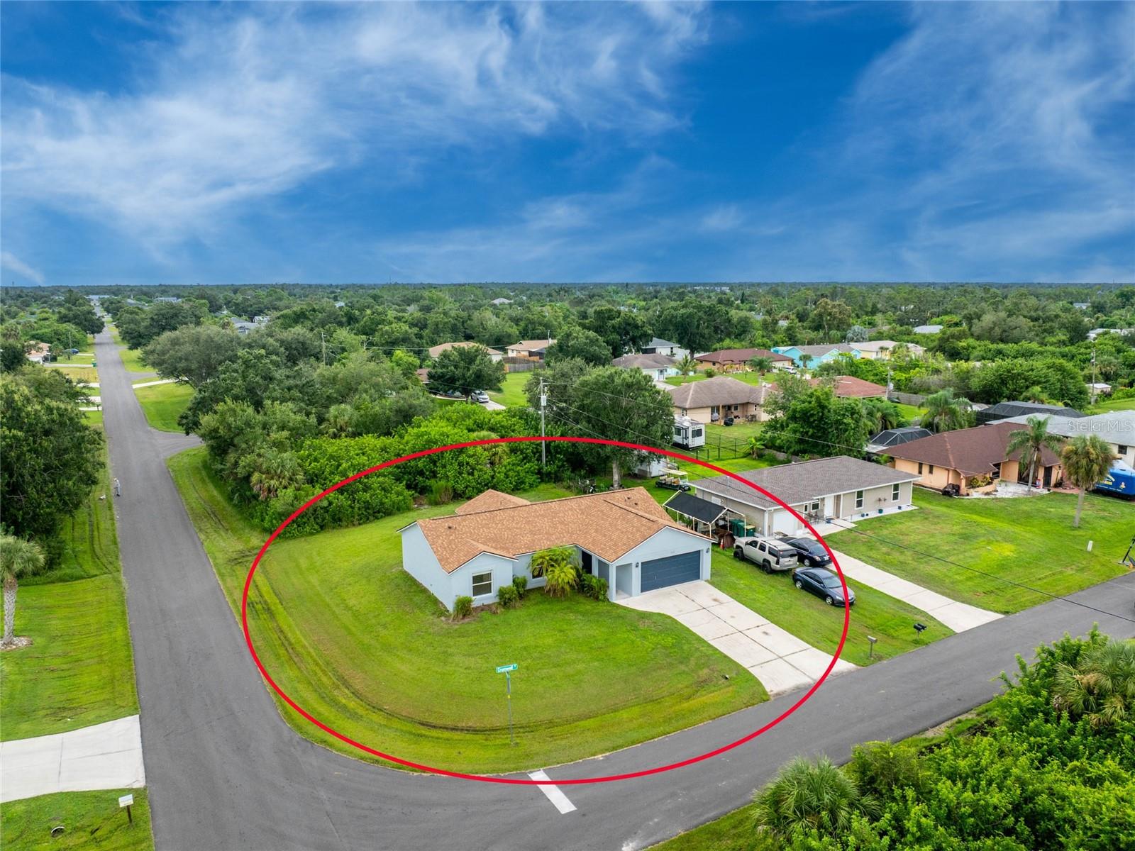Live Your Way in East Englewood With No HOA, X Flood Zone, and Easy Access to Beaches, Shops, and Dining! This inviting three bedroom, two bath home is move-in ready with a 2023, 2024 HVAC and water heater, plus fresh interior and exterior paint completed in 2025. Set on a desirable corner lot, this home offers an open split floor plan with vaulted ceilings, all-tile flooring, and spacious living areas designed for comfort and flexibility. The large kitchen provides ample wood cabinetry, generous laminate countertop space, and a convenient breakfast bar. The ensuite primary bedroom includes a roomy walk-in closet and a step-in shower, while the additional guest bedrooms each feature reach-in closets and share a guest bath with a classic tub and shower combination. Just off the dining area, a double set of French doors opens to the covered and screened lanai. This space would be perfect for creating an outdoor living area overlooking the oversized backyard, where there is plenty of room to add a pool. The two-car garage is equipped with built-in storage cabinets, shelving, and a workbench that makes it ideal for hobbies and projects. This location truly puts you in the heart of Englewood. You will be less than 8 miles from Englewood Beach and close to grocery stores, shopping, medical facilities, public boat ramps, and kayak launches. Sports and entertainment are also nearby, including year-round events on Historic Dearborn Street, spring training at Wellen Park for the Atlanta Braves, Charlotte Sports Park for the Tampa Bay Rays. If you are ready to start living the Florida lifestyle, 6126 Cromwell Street is waiting to welcome you. Contact us today to schedule your private showing.