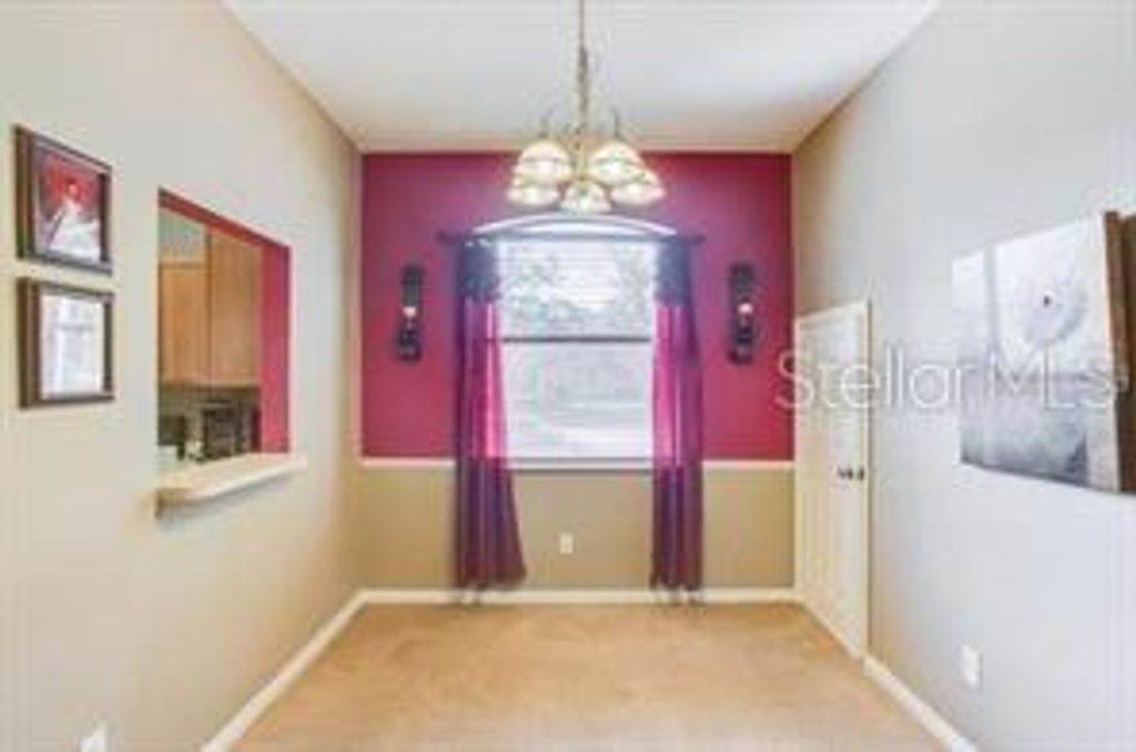 Photo of 6037 Scotchwood Glen #8, Orlando, FL 32822 (MLS # O6420471)