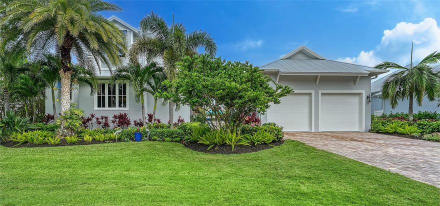 Discover the exclusive enclave of Triton Bend. This 4-bed, 5-bath residence is a masterpiece of enduring elegance. Constructed in 2014, the Spyglass model features a separate guest house and has been meticulously upgraded. The kitchen is a culinary haven, with Viking appliances, gas cooking, custom cabinetry, granite countertops, and a walk-in pantry. Upstairs, two bedrooms boast private baths and walk-in closets. Across the breezeway, the private guest house features an ensuite bath, walk-in closet, and poolside patio. A 2-car garage ensures effortless convenience. The spacious courtyard is an oasis ideal for year-round coastal entertaining. Featuring an exquisite pool, gourmet summer kitchen, and lush landscaping for ultimate seclusion. This coastal gem harmonizes elevated design, energy efficiency, and hurricane-grade durability. Enjoy the convenience of beach access steps away. Perfect mid-key location and free from HOA fees. This Longboat Key treasure redefines refined living, the epitome of coastal luxury.