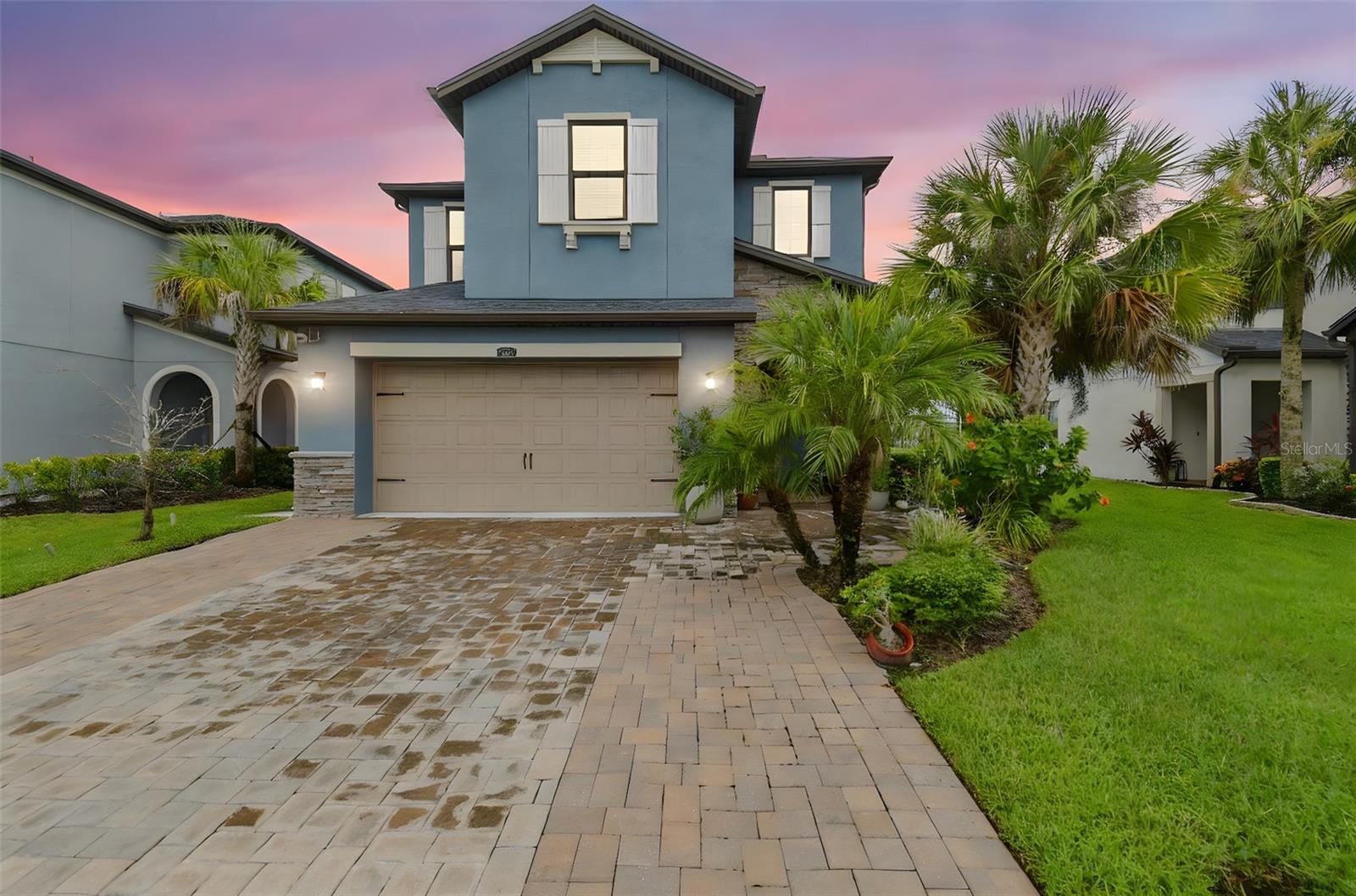Welcome to Estancia at Wiregrass, Pasco County’s premier master-planned community! This stunning 4-bedroom, 3-bathroom offers over 3,200 sq. ft. of beautifully designed living space with modern finishes, spacious rooms, and a seamless floor plan.
As you step inside, you’re greeted by bright, open-concept living areas perfect for entertaining. The gourmet chef’s kitchen features white shaker cabinetry, stainless steel appliances, double ovens, a gas cooktop, oversized island, and quartz countertops—flowing effortlessly into the dining room and family room with custom wall detail and panoramic sliding glass doors that frame serene water views.
The luxurious owner’s suite is a true retreat with a spa-like bathroom, dual vanities, walk-in shower, and expansive walk-in closet. A large upstairs bonus room provides the flexibility for a media space, home gym, or playroom.
Step outside to enjoy evenings on your covered lanai overlooking the lake, with plenty of backyard space for relaxing or entertaining.
Located in Lagona at Estancia, residents enjoy award-winning amenities including the Estancia Club with resort-style pools, fitness center, tennis courts, parks, playgrounds, and scenic walking trails. All of this in the heart of Wesley Chapel, just minutes from the Shops at Wiregrass, AdventHealth Center Ice, restaurants, top-rated schools, and I-75 for an easy commute to Tampa.