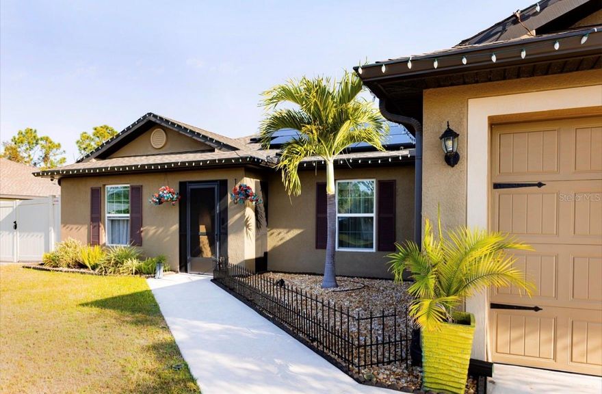 Welcome to your personal paradise with this stunning home, where outdoor living reaches new heights! Imagine hosting friends and family in your luxurious 750sqft lanai, complete with a fully equipped commercial grade outdoor kitchen, a state-of-the-art grill, dishwasher, exhaust fan, starry lighting sky, and even a refreshing private shower to wash off the day’s adventures. Experience the perfect blend of luxury and nature, right in your own backyard! Welcome home to your luxurious 2900sqft UNDER ROOF 2022 BLOCK BUILT with SOLAR PANELS 3 Bedrooms, 2-bathrooms, 2 car garage Insulated with Epoxy floors, shelving, and Air Conditioned for your toyz! Not in flood zone! No HOA, No CDD, No rental restrictions! Perfect Your Forever home or AIRBNB! Complete hurricane shutters protection! Beautifully landscaped front and backyard including multiple fruit trees such as: bananas, ananas, grapefruits, vanilla tree, guava, tomatoes, passion fruit, mango, papaya, orange, star fruit, cherry, jasmine, and others!!! All fenced in for your furry family and large 16x10 air conditioned with electricity shed/workshop, with paved boat/RV space! Irrigation system installed! The list goes on and on! As you walk in your meticulously maintained home you will be wowed by beautiful Luxury vinyl plank flooring throughout! And  newer stainless steel appliances! High grade granite countertops in kitchen and matching granite counters in all bathrooms! Upgraded lighting system throughout! Long extended driveway the list goes on and on! Continue your journey into the heart of the home, where the open kitchen seamlessly blends with the spacious great room. The kitchen, a culinary enthusiast’s dream, features huge central island with a convenient dishwasher and sink. A generously sized pantry ensures you have ample storage space, making it easy to keep your kitchen organized and clutter-free. Split bedroom plan ensures privacy and tranquility. On right side of your home, discover the owner’s suite – a sanctuary of comfort and style. Wow yourself with spacious walk-in closet, providing a home for your wardrobe and accessories. The owner’s bathroom is a retreat in itself, complete with a linen closet and all the modern amenities you desire. On the opposite side of the home, you’ll find bedrooms 2 and 3, each offering a cozy haven for rest and relaxation. These bedrooms share a well-appointed bathroom and a convenient hallway linen closet, adding an extra touch of practicality to your daily routine. The convenience continues with the strategically placed laundry room, just off the kitchen, making chores a breeze. From there, access your 2-car garage, ensuring that you and your toys are well taken care of. Welcome home to where is not just a house; it’s a home designed for modern living, where every detail has been carefully considered to enhance your lifestyle. Imagine your days in this thoughtfully crafted space, where comfort meets sophistication, and memories are made. The lifestyle, where luxury meets practicality. Located in a quiet neighborhood yet close to shopping, dining, and top-rated schools, Tampa Bay Rays Spring training, Famous Wellen Park, Cool Today Park, Multiple beaches, Warm Mineral Springs, Port Charlotte Mall/restaurants entertainment, Port Charlotte Beach Park, easy access to route 75 and I-41 Do not miss your opportunity to own this sunshine retreat! Call for your private showing today!