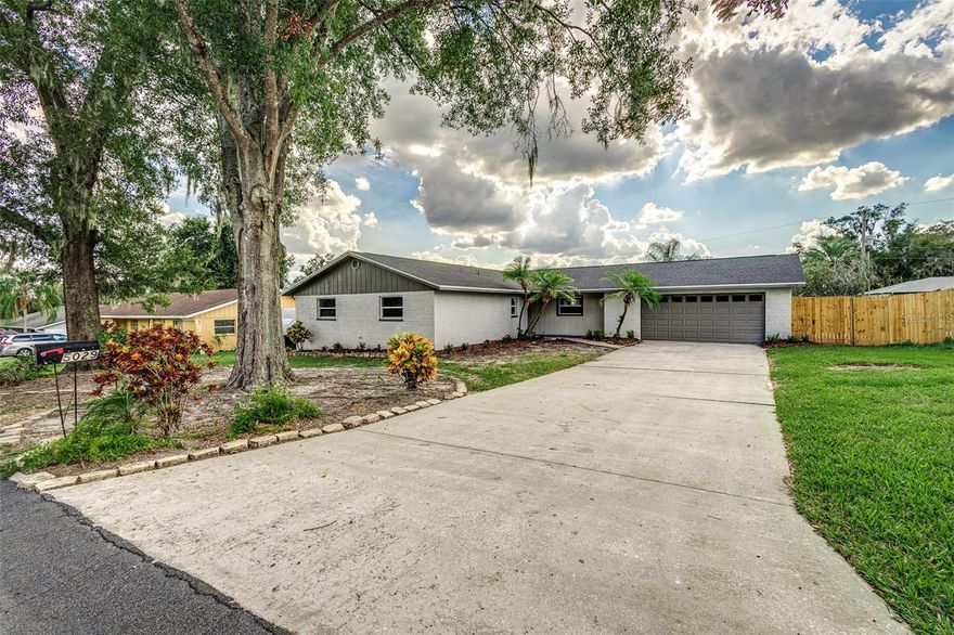 Location, location, location! This newly renovated home is ideally situated in South Lakeland, close to schools, parks, shopping, and dining. Whether you're looking for a quiet evening by the pool or wanting to entertain your friends and family, this property has everything you need. This home has been thoughtfully updated to offer you peace of mind and comfort, including a new A/C system, a new roof, a new drain field, updated electrical and plumbing, new windows, and all new flooring, ceiling fans and light fixtures. The interior of this home features 4 bedrooms and 2 bathrooms, providing plenty of space for family and guests, with the potential of using a bedroom for a flex space or home office. The spacious kitchen is brand new with stainless steel appliances, granite countertops and new cabinets, closet pantry, kitchen island with counter-height bar, and breakfast nook, all with a view of the back porch and pool through the new sliding door. The interior also features a formal dining room, spacious master suite with updated, private bathroom, and updated guest bathroom. Step outside to your backyard oasis. The covered rear porch and screened-in pool and pool deck provide a tranquil retreat perfect for cooling off during hot summer days or soaking in the Florida sun. The fully fenced-in yard provides plenty of privacy and allows a safe space for families and pets to play. In the front yard, you’ll find a covered front porch, new and mature landscaping, a large attached 2-car garage with new door and opener, and spacious driveway providing plenty of additional parking.