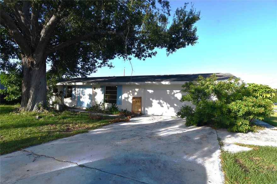 HANDYMAN SPECIAL! Port Charlotte oversized corner-lot property, presenting a unique opportunity to restore and transform a 2-bedroom, 2-bathroom residence into a new home. With 1,013 square feet of living space, a spacious 2-car garage featuring washer and dryer hookups, and a screened-in POOL. This property offers great potential for those with vision and a passion for home improvement. While this home is in need of major restoration and may require gutting, the potential for creating a custom, stylish, and comfortable living space is abundant. Imagine transforming this property into the home of your dreams, reflecting your unique tastes and preferences. With a little creativity and effort, you can unlock the hidden beauty of this space. If you're ready to take on a renovation project and craft a home that suits your lifestyle, this property could be the canvas you've been searching for. Don't miss this rare opportunity to make your mark on a 2-bedroom, 2-bathroom, 2-car garage, and pool home in a prime location.