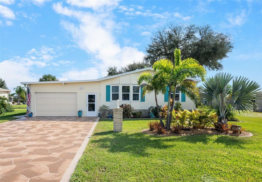 Experience the best of Florida living in the spacious manufactured home nestled in the 55+ community of Lemon Bay Isles! Offering comfort, versatility, and a relaxed coastal lifestyle, this home features a SPLIT FLOOR PLAN, A WORKSHOP INSIDE THE GARAGE, and a tropical, AIR-CONDITIONED FLORIDA ROOM perfect for entertaining or unwinding in year-round comfort. ~~~Invite guests into the welcoming living room, where you can catch up on the latest news or enjoy the big game together. Hosting is a breeze in the well-equipped kitchen featuring STAINLESS STEEL APPLIANCES and a convenient closet pantry. A PASS-THROUGH WINDOW to the Florida room makes refilling drinks effortless as you play cards, sip your favorite beverage, or simply relax in style. Dine in the formal dining room or at the cozy breakfast nook, then step outside to the private BACKYARD PATIO to soak up the Florida sunshine. ***Your PRIMARY SUITE serves as a peaceful retreat with a spacious WALK-IN CLOSET AND A PRIVATE EN-SUITE BATHROOM complete with dual sinks and a shower. Guests will appreciate their comfortable bedroom and full bath, while the DEN provides the perfect flex space ideal for a home office, craft room, fitness area, or even a third bedroom. ~~~Additional highlights include an indoor laundry closet, a new roof (2022), and HURRICANE SHUTTERS for most windows for added peace of mind. Keep your landscaping lush with an IRRIGATION SYSTEM ON A WELL and enjoy ample storage for tools and hobbies in your garage WORKSHOP. Both the garage and workshop also include EXHAUST FANS controlled by a thermostat to keep the areas cool! ***Located in the active 55+ community of Lemon Bay Isles where you can take advantage of the amenities of the Lakeside Club including a COMMUNITY POOL, pickleball and tennis courts, shuffleboard courts and clubhouse so you can stay active and meet your neighbors! A few blocks from 776, enjoy a variety of dining and shopping options. Take a short drive to Englewood and Manasota Beaches, world-class fishing & boating, numerous golf courses and more. ~~~Don’t miss your chance to live the Florida lifestyle you’ve been dreaming of. Schedule your private showing today and make this incredible home yours!