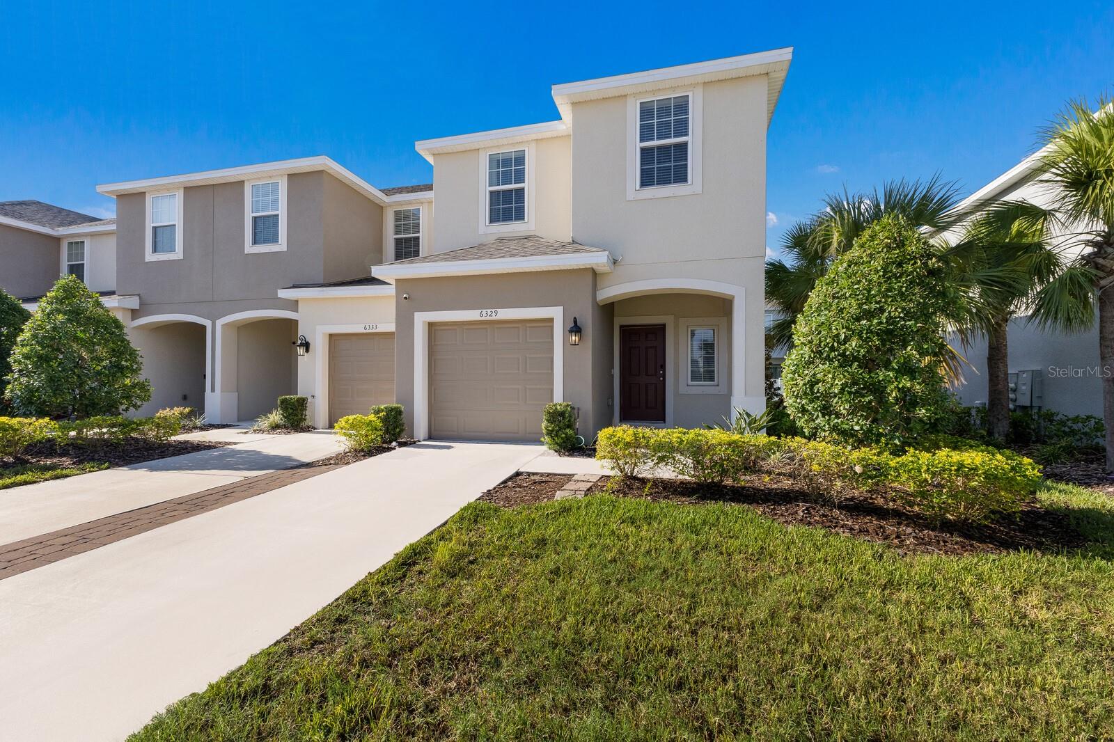 Step into this stunning 3-bedroom, 2.5-bathroom townhome offering 1,607 sq. ft. of beautifully designed living space in the highly sought-after luxury community of Artisan Lakes. This nearly new end-unit townhome combines modern finishes, functional design, and resort-style amenities for the ultimate low-maintenance lifestyle. As you enter through the one-car garage or front entry, you’ll find a convenient half bath and a dedicated storage area—perfect for luggage or seasonal décor. The open-concept main level features a spacious living and dining area that flows seamlessly into the gourmet kitchen, complete with a large quartz island for entertaining, shaker soft close cabinetry, quartz countertops and pantry storage, stainless steel appliances, and direct access to the brand-new screened-in patio via three-panel sliding glass doors. Upstairs, a flexible loft niche makes the ideal spot for a home office or reading area. The oversized primary suite offers a large walk-in closet and a spa-like ensuite bath. Down the hall, you’ll find the laundry room, a second full bath, and two additional bedrooms with generous closet space. Living in Artisan Lakes means enjoying a true resort lifestyle with community amenities including two sparkling pools, outdoor kitchen, fire pit, and even corn hole. Located in the heart of everything, you’re just: 20 minutes to St. Pete or Sarasota, 35 minutes to Brandon, 40 minutes to Tampa, less than 5 minutes to I-75 and I-275, 20 minutes to some of Florida’s best beaches. Don’t miss your chance to call Artisan Lakes home—schedule your showing today!