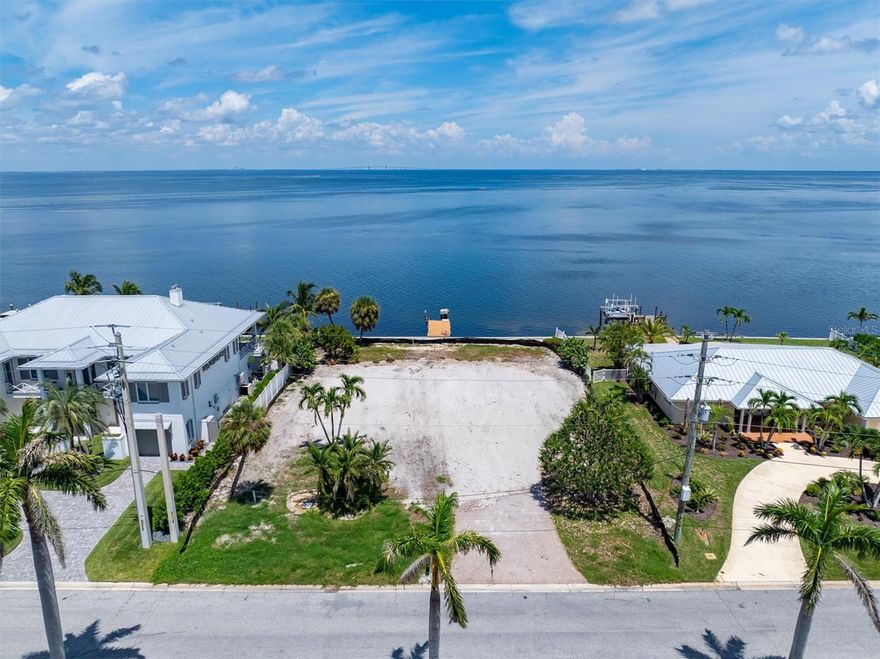 VACANT, CLEARED AND READY TO GO! Discover a truly exceptional opportunity to own one of the finest Bayfront lots on Anna Maria Island, nestled in the exclusive boating and golfing enclave of the Key Royale neighborhood. This build-ready, deep-water lot spans approximately 15,000 sq. ft., offering an impressive 100 feet of direct frontage on Tampa Bay.
Whether you're envisioning a private waterfront estate or a vacation retreat, the lot’s generous size and prime location offer unlimited potential.
Enjoy easy access to the Gulf, serene sunrises over the bay, and world-class boating right from your backyard. Plus, you're just a short stroll or golf cart ride from Anna Maria Island’s top-rated restaurants, boutique shops, and sugar sand beaches.
Don't miss this rare chance to build your dream home in one of the most desirable waterfront settings on Florida's Gulf Coast.
