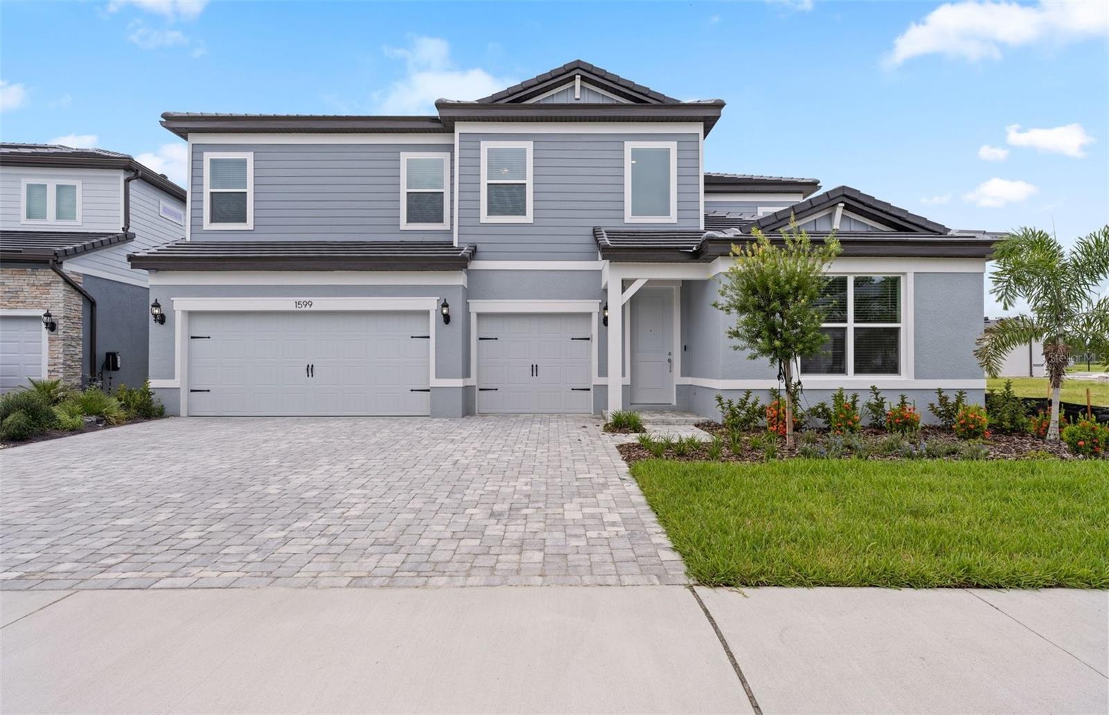 Move in Ready Available NOW!! Pulte Homes is Selling in Two Rivers! Two Rivers is a master-planned community near Wesley Chapel that is enveloped by woodlands, grasslands, and waters. Amenities will include a clubhouse with a resort-style pool, fitness center, nature trails, parks, shared green spaces, and so much more.
This new consumer-inspired Merlot home design has the space your family has been looking for! The gourmet kitchen showcases a large center island with a single bowl stainless steel sink. There are stylish cabinets, 3cm quartz countertops with tiled backsplash, a spacious pantry, and Whirlpool stainless steel appliances including a dishwasher, built-in oven and microwave, and stovetop with range hood.
The bathrooms have white cabinets and quartz countertops and a walk-in shower, private commode, and dual sinks in the Owner's bath. There is 6”x36” tile flooring in the main living areas, owner’s suite baths and laundry room, and stain-resistant carpet in the secondary bedrooms and loft.
This home makes great use of space with a 1st-floor Owner’s suite with a large Owner’s retreat area and spacious walk-in closet, a 2nd story with a loft, a private full bath off the third bedroom, a convenient laundry room, a 3-car garage with epoxy flooring, and a spacious covered lanai.
Additional upgrades and features include a pocket sliding glass door at gathering room, LED downlights in gathering room, floor outlet, whole house faux wood blinds and a Smart Home technology package with a video doorbell.
Enjoy peace of mind with Pulte’s transferable, 10-year Limited Structural Warranty that covers materials and workmanship in the 1st year, workability of plumbing, electrical, HVAC, and other mechanical systems through the 2nd year, various types of water infiltration and internal leaks through the 5th year, and the structural integrity of the home through the 10th year. Plus, we’re currently offering limited-time incentives and below-market rates!