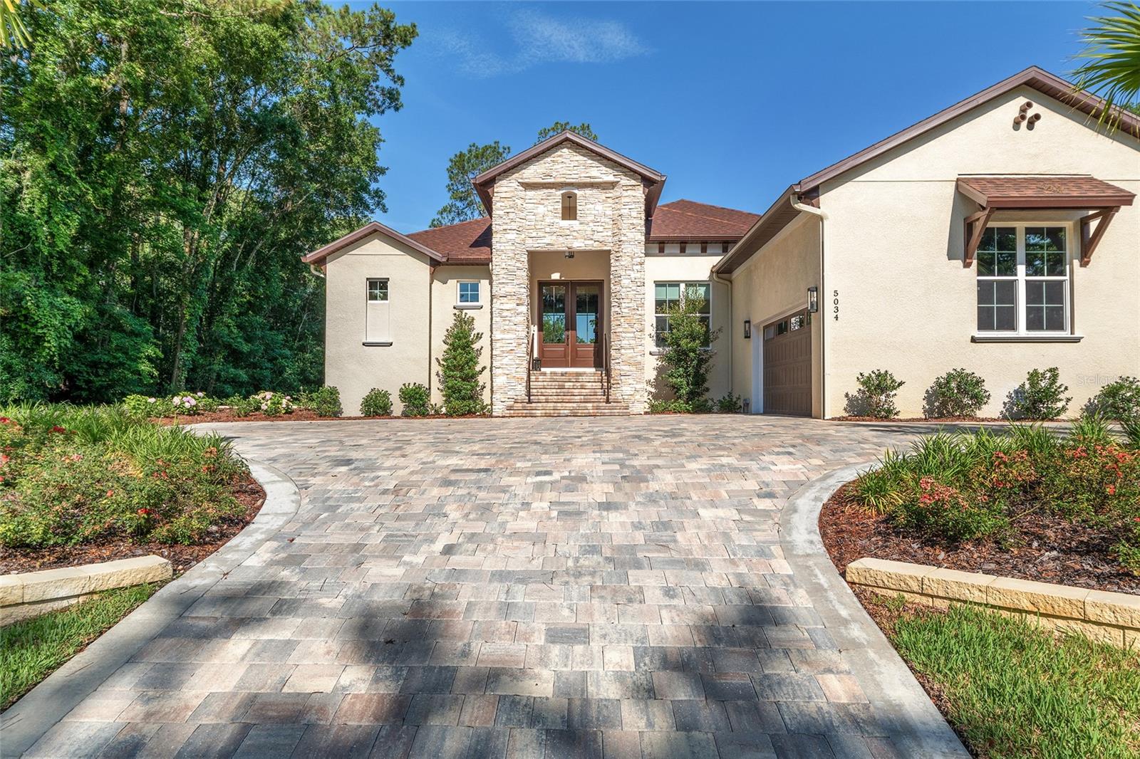 This exceptional, newly constructed Arthur Rutenberg home in the sought-after Golden Hills community is a rare find. Perched high above the golf course, this stunning 3-bedroom, 2.5-bath residence with a split floor plan is thoughtfully designed for modern living.
Step inside to discover luxury upgrades and designer finishes throughout. The chef’s kitchen is a standout, featuring a gas cooktop with wall built in oven/microwave combo, an oversized island, and a spacious walk-in pantry—perfect for entertaining or everyday life. The kitchen flows seamlessly into the open-concept family room, where 10-foot glass doors span the entire rear wall, framing breathtaking views of the golf course and leading to the expansive patio. The spacious 773 sq ft solar illuminated back patio provides a magical glow in the evening overlooking the golf course, perfect for dining and entertaining with or with the glass panel sliding doors open or closed- making the entertainment space twice the size.
The oversized primary suite is a peaceful retreat, offering serene views of the golf course. The primary bathroom has an oversized walk in shower and beautiful soaking tub. The elegant ensuite includes high-end finishes and ample space. The two additional bedrooms share a beautifully appointed bathroom with a walk-in shower.
A spacious office also overlooks the fairway and is conveniently located next to the half bath, offering an ideal work-from-home setup. The large laundry room is tucked just inside the back entrance from the oversized two-car garage, adding everyday convenience.
The landscaping of this property provides the finishing touches complimented with electric timed flood lighting illuminating the home at night,
Ideally located across from Golden Ocala and just minutes from the World Equestrian Center, this property places you in the heart of Central Florida's equestrian and golfing paradise. Come see the unmatched features and craftsmanship for yourself—schedule your private showing today! More pictures to follow.