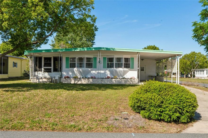 Step into easy Florida living with this charming and fully furnished 2-bedroom, 2-bathroom 1972 mobile home, perfectly suited for full-time residents or seasonal getaways. From the moment you enter, you’ll appreciate the stylish luxury vinyl plank flooring, beamed ceilings, and the spacious living and dining areas—ideal for relaxing or entertaining. The primary suite offers comfort and convenience with a walk-in closet and a private ensuite bathroom featuring a walk-in shower. A second bedroom and bath provide ample space for guests. This home is truly move-in ready—just bring your clothes! The sale includes all furnishings as well as a golf cart, housed in its own dedicated golf cart garage. There are also an attached garage and a versatile workshop area with a washer and dryer for added functionality. Enjoy year-round sunshine in the large, enclosed Florida room, finished with plexiglass windows, creating the perfect space to unwind or host friends. Located in a vibrant 55+ gated community, residents enjoy an array of amenities including a golf course, clubhouse, community pool, bocce ball courts, library, and a full calendar of daily activities that foster an active and social lifestyle. Conveniently situated near SR50, you’ll have quick access to hospitals, grocery stores, restaurants, shopping, and the renowned Weeki Wachee Springs Park. Whether you're looking for a full-time residence or a seasonal retreat, this home offers comfort, convenience, and community—all in one inviting package.