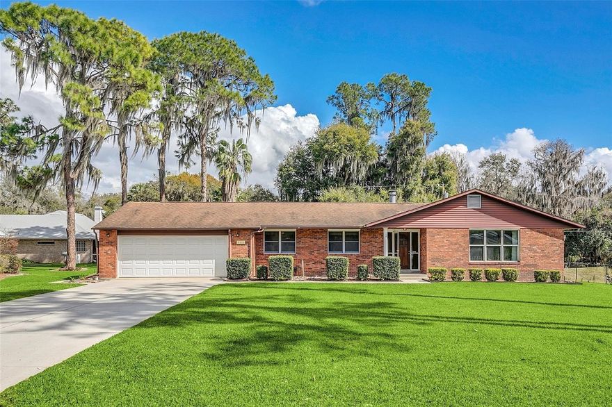 "LAKE EUSTIS & THE HARRIS CHAIN", 4-BEDROOMS, 3.5-BATH, SINGLE FAMILY HOME, TOTALLY UPDATED & MOVE IN READY, EUSTIS FL 32726. This gorgeous property sits on a .46-acre lot, Canal Front just 300' from Lake Eustis, and has "NO HOA RULES, FEES, OR RESTRICTIONS". Are you into Boating, Skiing, Fishing or just want to be on water enjoying LAKE LIFE? Check out this "FULLY REMODELED" home at the end of a semi-private street with a full interior $261,000+ "Redesign & Remodel" that will impress the Pickiest Buyer. If you enjoy an "Open Concept Design", you'll love the modern Living, Dining & Kitchen layout that includes a Brand "NEW" Chef's Kitchen including Allen & Roth 42" Solid Wood Upper/Lower Cabinets w/Soft Closet Drawers, Built-In Organizers, Matching Island w/Tons of Storage, Exotic Granite Countertops, Stainless Appliance Pkg w/Dual Ovens, Flat Top Range, Country Farm Sink, Custom Tile Backsplash, "HUGE" Walk-In Pantry, and all "NEW" Hardware & Fixtures. The Primary Suite was enhanced in size and is the perfect "Couples Retreat". This space will accommodate all of your oversized furniture & includes a large walk-in Closet with a Custom Organizer. The Primary Bath was totally Re-Imagined, and everything is "Brand New" including an Oversized Soaking Tub, Walk-In Shower w/Frameless Glass Enclosure & both include Custom Wall & Floor Tile, "NEW" Luxury Wood Cabinets w/tons of Upper/Lower Storage, Granite Countertops, Dual Under Mount Sinks, Linen Closet, and "NEW" Hardware & Fixtures. The Additional (3) Bedrooms were all Updated with New Paint, Flooring, Ceiling Fans, Lighting, Doors, Trim & Baseboards. The Ensuite, Hall & Powder Room Baths all were totally renovated including new Tubs or Walk-In Showers, Vanities, Flooring, Toilets, Hardware, Fixtures. Do you enjoy working out? Carpenter? Mechanic?...the home features a "LARGE" Workshop or Private Gym with tons of space, storage and a roll-up door. There's also a Covered & Screened Rear Porch which is perfect for grilling, chilling, or watching the sunrise over your dock & canal. The back yard includes 67' feet of waterfront on the extra wide canal & includes a 12'x20' Boathouse w/Lift, Full Electric & Water Service, 11'x12' Wood Deck, Lighting & Aluminum Seawall. Additional Features: Flat & Level Yard, NEW Roof (2024), Full Interior Renovation (2022), NEW Double Paned Windows (2023), Updated Plumbing & Electric (2022), HVAC System (2013), NEW 60gal Water Heater (2022), Closet Organizers in all Bedrooms, Real Wood Burning Fireplace, Oversized Garage w/Opener & Storage, Full Interior Repaint (2022), All NEW Interior 2-Panels Doors & Hardware, Trim & Baseboards (2022), ProCore Series Luxury Vinyl Plank (LVP) throughout (2022), NEW Ceiling Fans & Lighting Fixtures (2022), NEW Fenced Rear Yard (2022), NEW Smart Garage Door Opener (2026), NEW Drain Field (2023), NEW Irrigation Upgrade (2023), NEW Landscaping (2023), and so much more. If you've dreamed of the LAKE LIFESTYLE, come check out this amazing home. The Harris Chain of Lakes is made up of over 77,000+ acres that will impress any water enthusiasts. Future adventures can include a short boat ride leading you to a variety of local restaurants or navigate the picturesque Dora Canal for shopping & dining in the charming towns of Mount Dora & Tavares. PARADISE AWAITS! Call today for more info or to schedule a private showing.