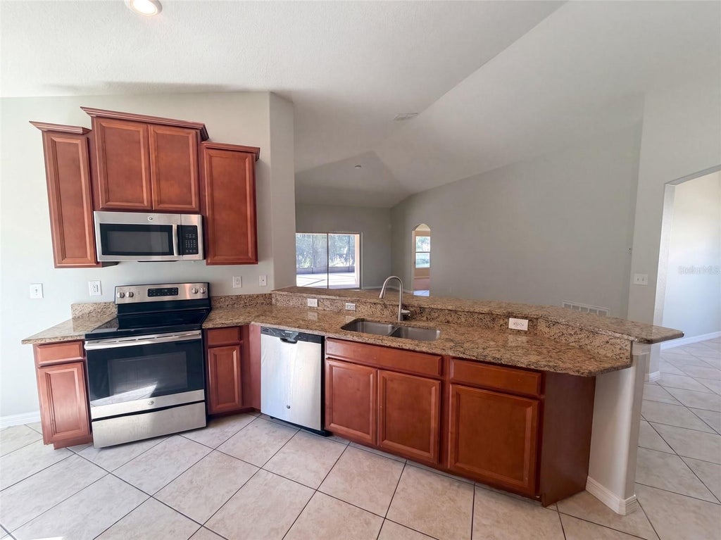 Photo of 10080 Tolman Drive, Hudson, FL 34667 (MLS # O6448653)