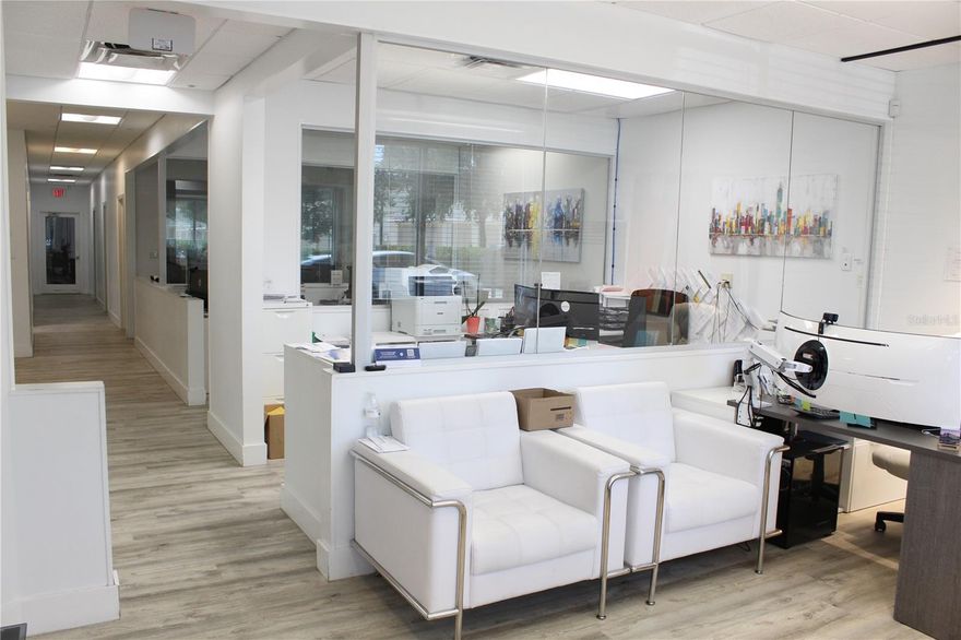 This upgraded and professionally maintained industrial/office unit offers 3,635 square feet of adaptable space, ideal for a variety of business uses including light manufacturing, distribution, tech, or creative operations. The unit features high-clearance warehouse space with a 20-foot clear height and an included vertical lift module system, providing efficient storage and logistics capabilities. The main floor includes five offices, a reception area, conference room, kitchen, two restrooms, a storage room, and a dedicated security control room. The second floor offers a spacious executive office and a versatile flex room that can serve as an additional office or meeting space. Access is streamlined with two dock-high loading doors and a loading dock access point. The unit also includes six dedicated parking spaces at the front, with additional parking available in the rear. This facility delivers a clean, functional, and professional environment suited for businesses seeking a flexible and efficient workspace.