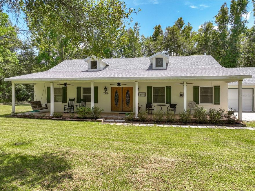 Discover the pinnacle of peaceful living in this remarkable oasis nestled on a sprawling 1.01-acre lot in beautiful Brooksville. This home features an array of features that cater to your every desire. From the moment you step through the beautiful double doors, you'll be captivated by the vaulted ceiling and open floor plan to create an airy and spacious feel. This country home boasts an impressive three bedrooms, two full bathrooms, and one half-bath offering ample space for relaxation and rejuvenation. The heart of this home is the gourmet kitchen, complete with stunning granite countertops, stainless steel appliances, and a breakfast bar. The eat-in-kitchen design ensures that every meal is a delightful experience. A convenient kitchen pantry provides ample storage. Entertain with style in the expansive great room, where the vaulted ceilings elevate the sense of space. French doors lead to a versatile den, perfect for a home office, library, or creative space. The elegant screened cabana beckons you outdoors, connecting seamlessly to the 14x28 pool and pool heater—a haven for relaxation and poolside gatherings. This residence is designed for the utmost convenience and comfort. The home is handicapped accessible, and a laundry room with a deep sink, cabinets, folding table, and even an ironing board ensures that chores are a breeze. The laundry room is ingeniously designed to double as a pool bath, complete with a commode. Outdoor enthusiasts will appreciate the RV hookup, the brick paver pool deck, and the screened cabana that offers an ideal shaded escape. An oversized garage easily accommodates larger vehicles, and a shed provides ample space for lawn equipment and storage. Embrace the tranquility of this 1.01-acre property, offering privacy with its natural surroundings. A gate ensures secure access to the property, while the lack of deed restrictions grants you the freedom to enjoy your space as you see fit. Additional features include a full home generator with rented propane tanks, a central vacuum system, pull-down stairs in the garage for easy attic access, and a recently replaced roof (November 2022). The water heater and pool screens were also recently replaced in April 2023 and 2022, respectively. Conveniently located near shopping, hospitals, and restaurants, this home offers both seclusion and accessibility. Whether you're enjoying the length of the home's front porch or exploring the local amenities, you'll find that this property truly has it all.