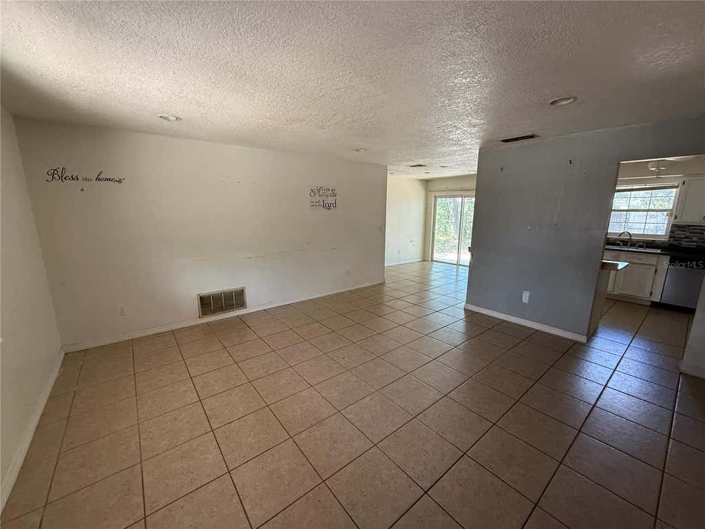 Photo of 3608 Tam Drive, Orlando, FL 32808 (MLS # O6436606)