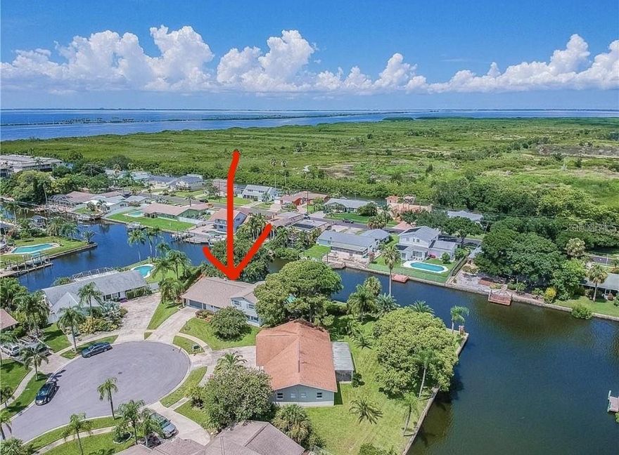 Rare opportunity for deep water canal lot in Tampa! Oversized **canal-front lot with 165 FT of seawall** on a **deep water canal with direct Tampa Bay access**. Located on a quiet **cul-de-sac**, this property features an **existing dock and pool** and is ready for redevelopment. Home has fire damage; **seller has quote for removal**, making this a prime build-ready opportunity. Approx. **121 ft lot depth** offers excellent design flexibility. Conveniently located just minutes to **Tampa International Airport, Veterans Expressway, Downtown Tampa, and Raymond James Stadium**. A short boat ride to the Bay. Ideal for builders, investors, or end-users looking to create a custom waterfront home.