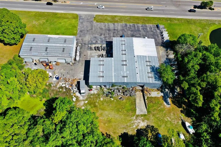 Great street exposure off busy 63rd street in central Bradenton! Other industrial companies surrounds but this one get the best exposure! Large 2.4 acres of clean land with 2 upgraded warehouses/showroom totaling 14500 square feet. One building feature 2500 sf of showroom/office with bathroom, 5500 sf warehouse with one graded dock/rolling doors and 2 ground docks with rolling doors, and 2000sf of canopy with roof for work station. The other building is a 4500sf warehouse features a small office with bathroom inside and 3 leveled rolling dock/doors. There are about 30 parking spaces in the front and plenty of parking and storage spaces on the sides and rear of  the buildings. The lot is pretty clean with some bushes/small trees/a retention pond for easy expansion.  Partial of the property is also for lease . Current businesses here include cabinets, countertop, electrician and auto repair/resale. Can be used as a store, gym, church, light manufacturing, storage, moving company etc, the possibility is endless!